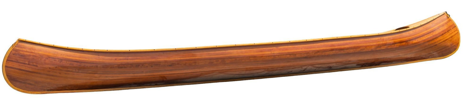 Monumental Wooden Canoe: Monumentally sized wooden canoe, with woven chord stern and bow seat, includes pair of oars height 2 ft. x width 3 ft. x depth 17 ft. 10 in. Provenance: Property from the monumental lifetime collectio