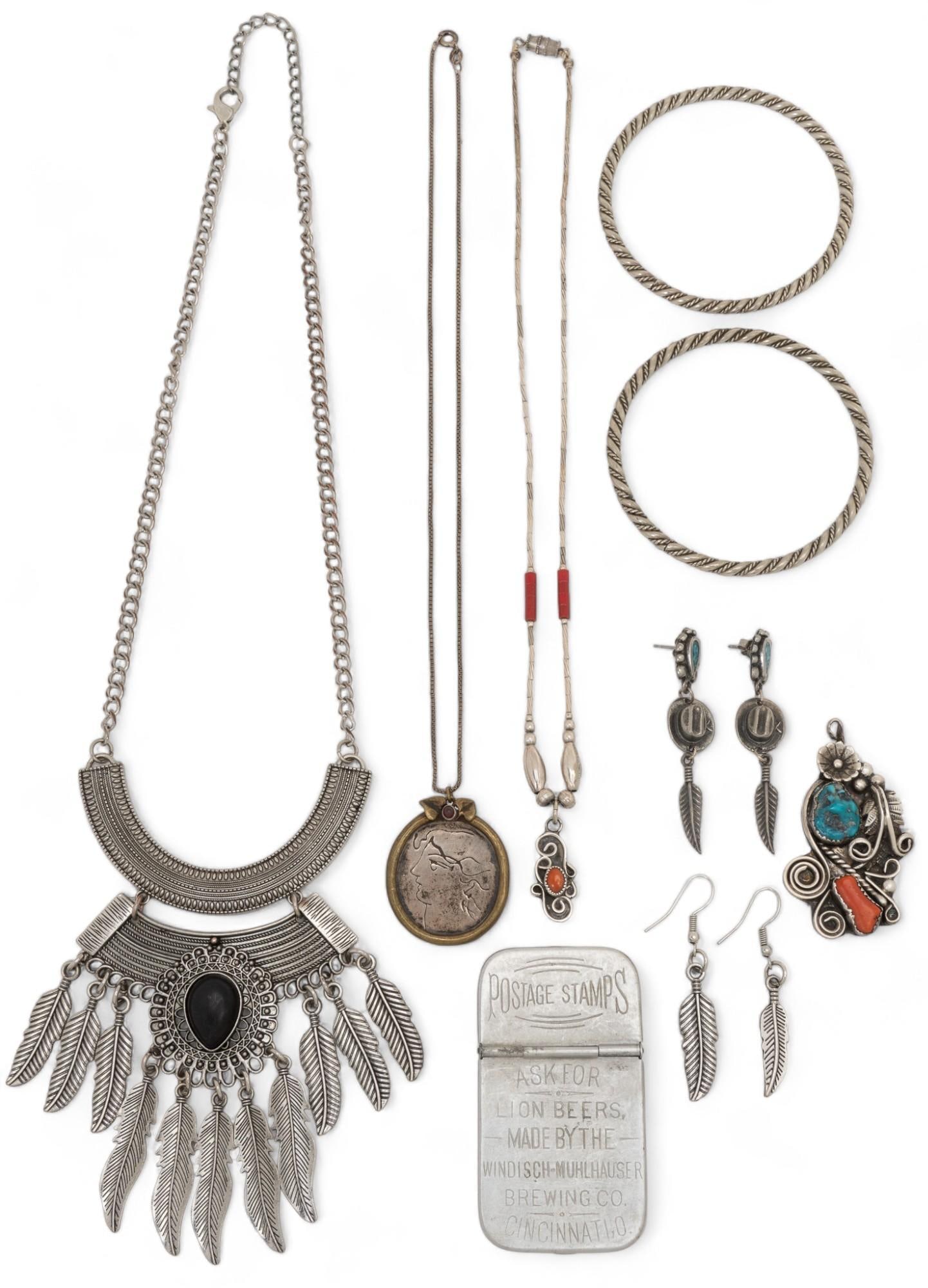Collection of Native American Style Jewelry: Collection of Native American style jewelry, includes two set of feather motif earrings, one turquoise and coral pendant, matching rolled metal motif bracelets, postage stamp holder, metal feather mot