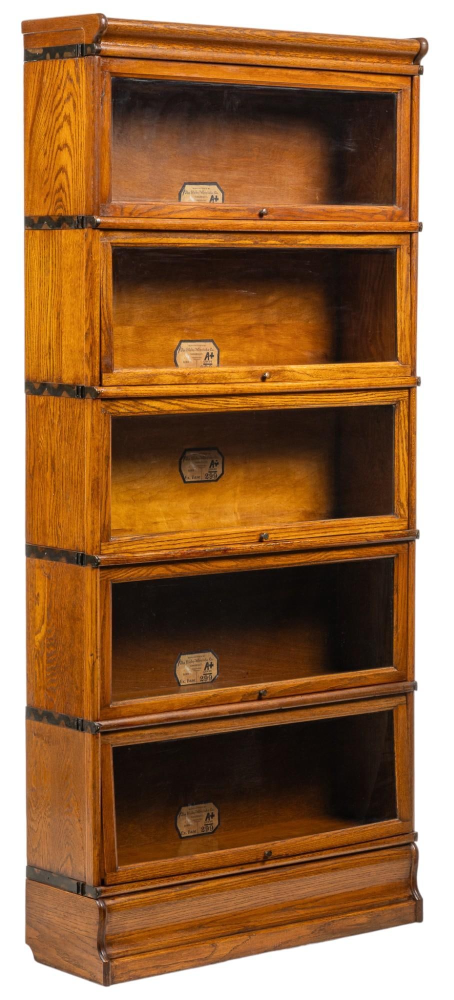 Globe Wernicke Stacking Bookcase: Globe Wernicke five-tier stacking barrister bookcase, each module having retracting glass door and original maker's label height 75 in. x width 34 in. x depth 10.5 in. Provenance: Property from th