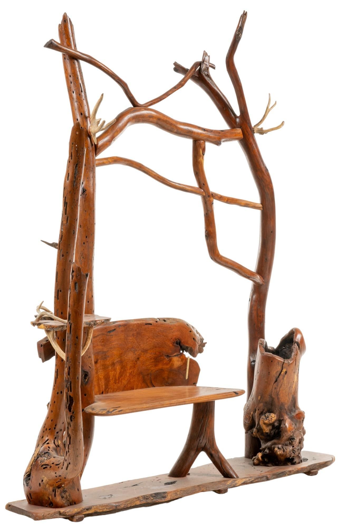 Rustic Hall Bench: Rustic hall bench featuring overhead archway of reclaimed wood, having some mesquite, with living edge details, and antler accents height 82 in. x width 67 in. x depth 22 in. Provenance: Property from