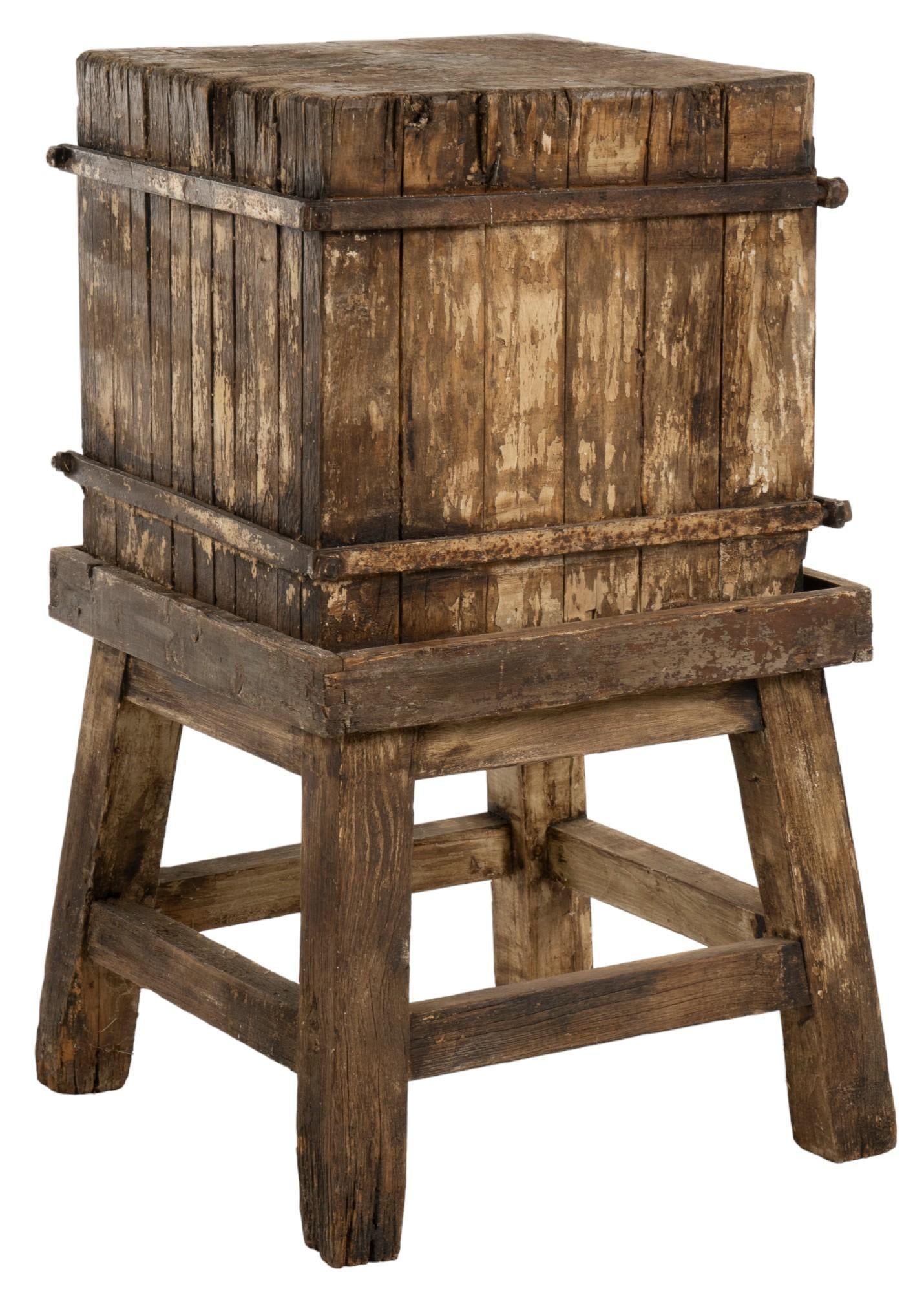Butcher's Block: Large rustic butchers block with iron hardware, supported on wooden base with stretchered block legs height 39 in. x width 23.5 in. x depth 23.5 in. Provenance: Property from the estate of a Nixon, Te
