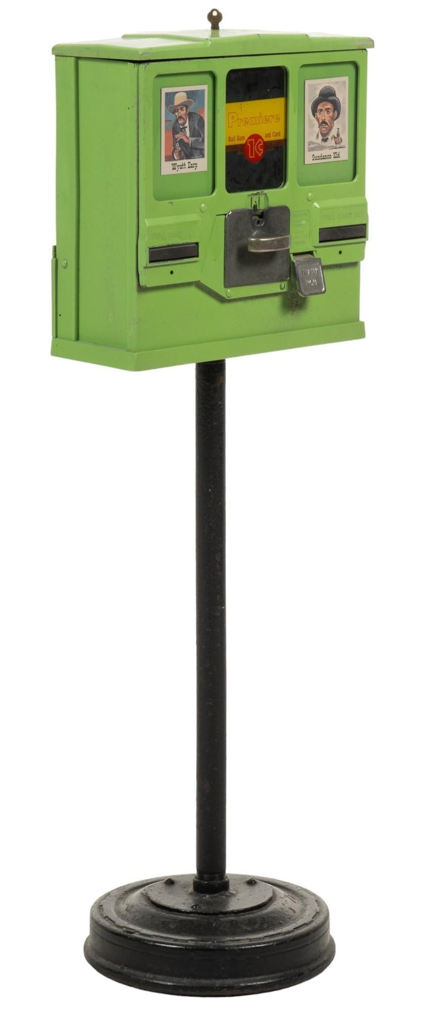 Gumball and Sticker Dispenser Machine: Vintage mechanical dispenser originally for gumballs and Western themed stickers, includes two keys, one for prize compartments, and one for coins storage height 40 in. x width 13 in. x depth 12 in. S