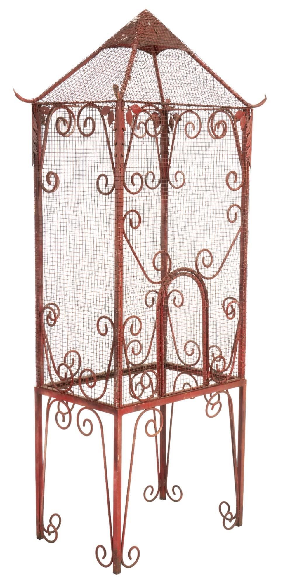 Vintage Bird Cage: Vintage bird metal birdcage, with wire mesh walls, peaking roof, and scrolled details throughout height 70 in. x width 29 in. x depth 19 in. Provenance: Property from the monumental lifetime collectio