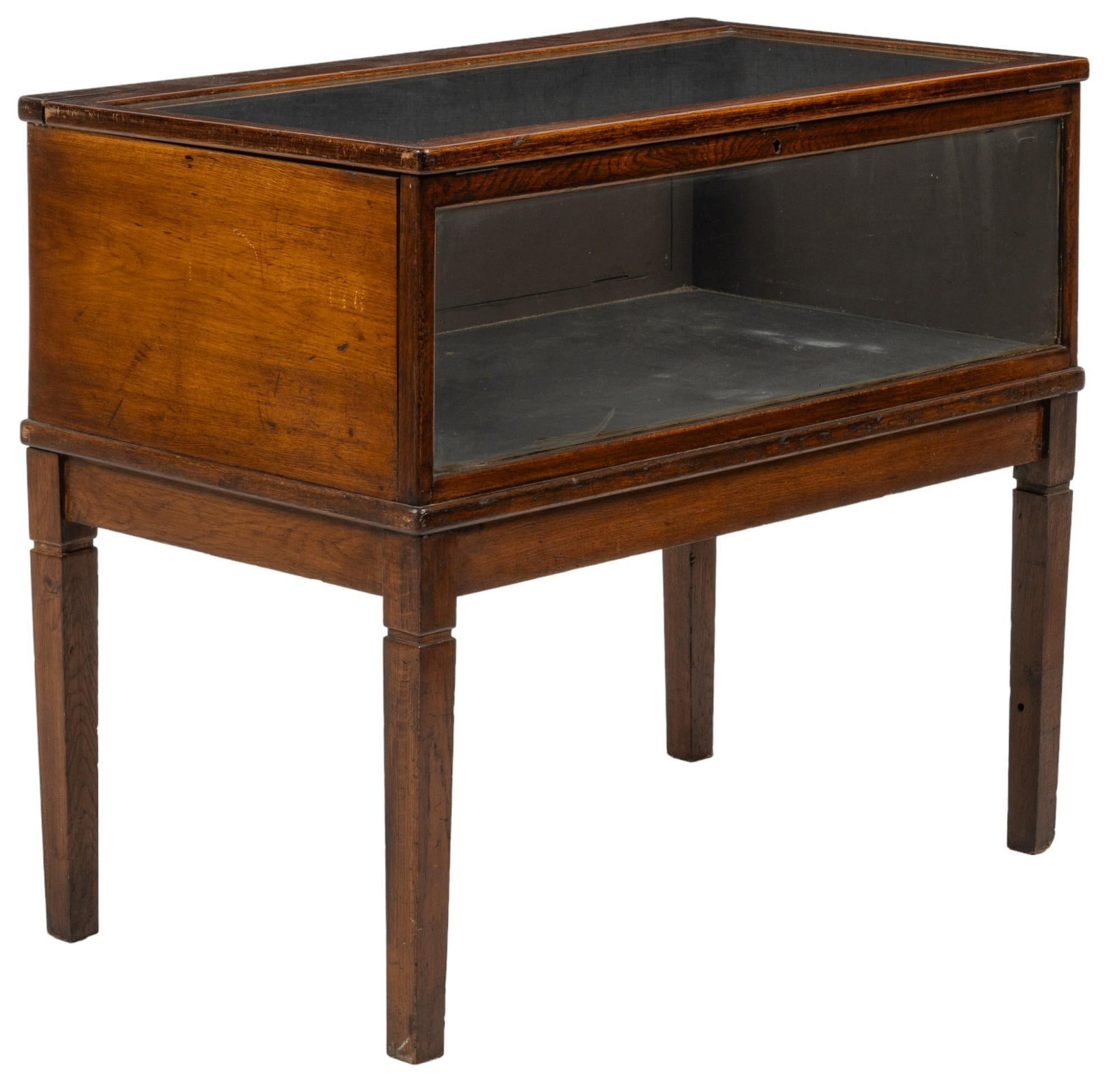 Glass Display Case: Glass display case, supported on block legs, with hinged lid top and front wall height 36 in. x width 42 in. x depth 24 in. Provenance: Property from the monumental lifetime collection of a distinguis