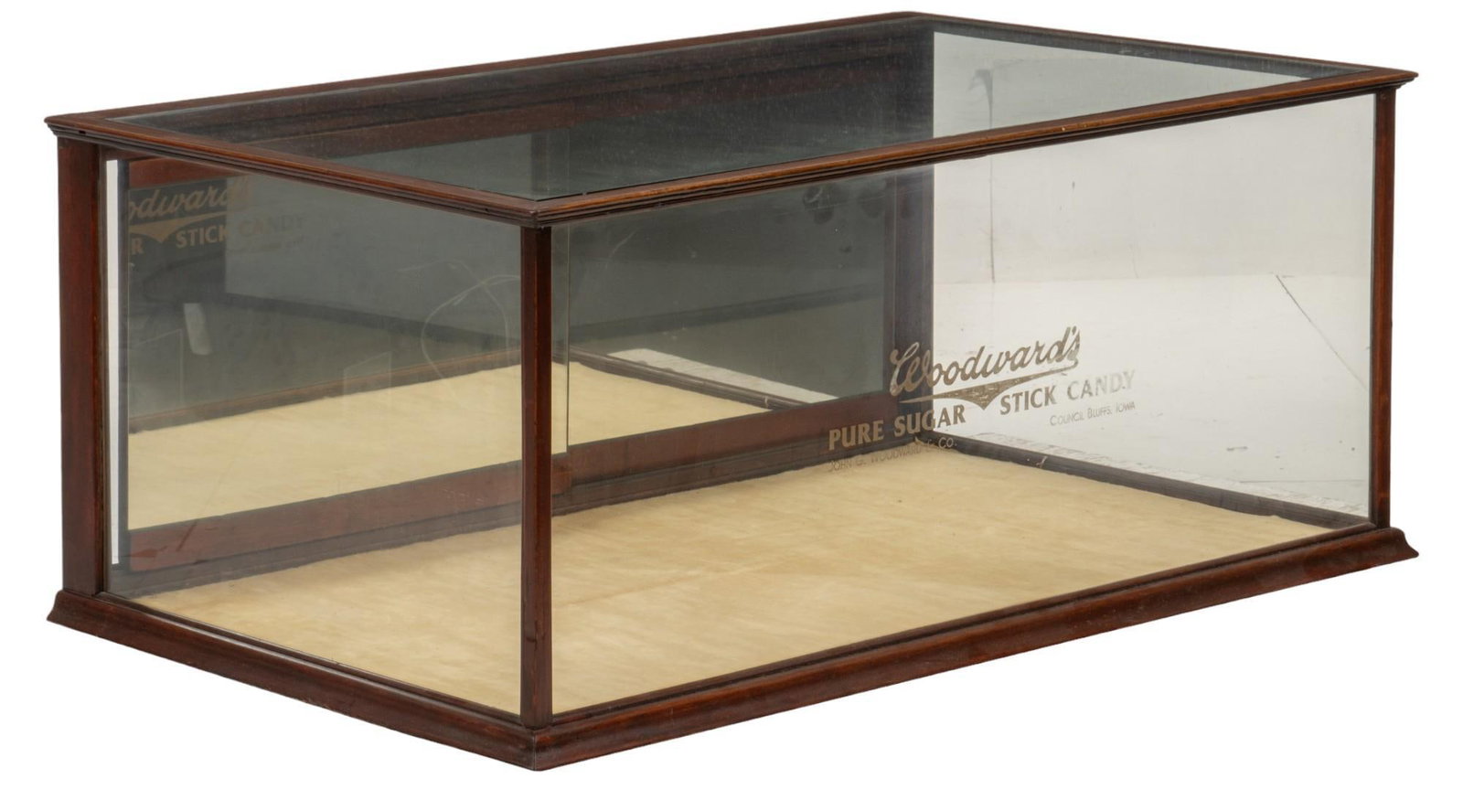 Woodward's Candy Shop Display: General store display case for Woodward's Pure Sugar Stick Candy, wooden case with glass to three sides, mirrored sliding door provides access at the back, stylized branding to front, circa 1920s 