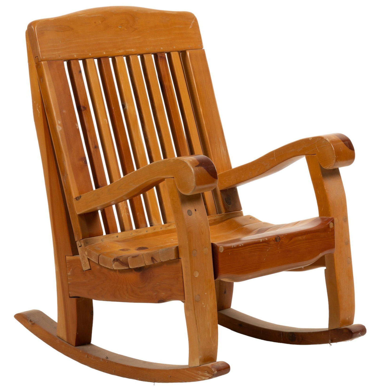 Rocking Chair: Wooden rocking chair featuring slat back, and scrolled armrests, supported on rockers height 42 in. x width 29 in. x depth 33 in. Provenance: Property from the monumental lifetime collection of a dist