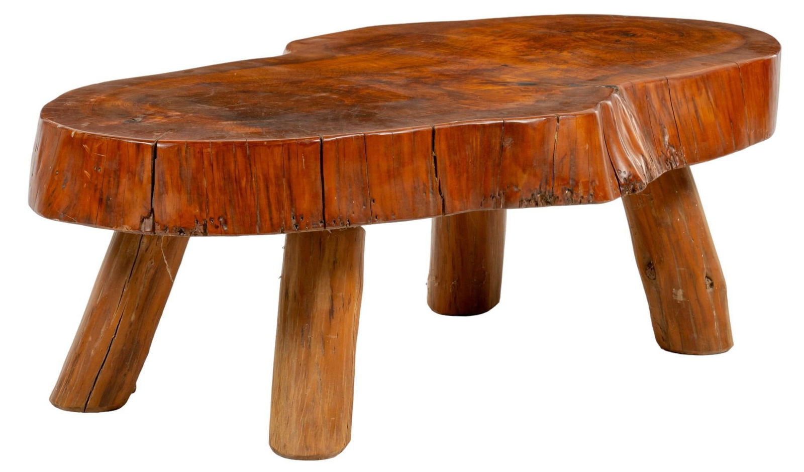 Log Coffee Table: Wooden live edge coffee table featuring log slice top, supported on four splayed log legs height 18 in. x width 53 in. x depth 30 in. Provenance: Property from the monumental lifetime collection of