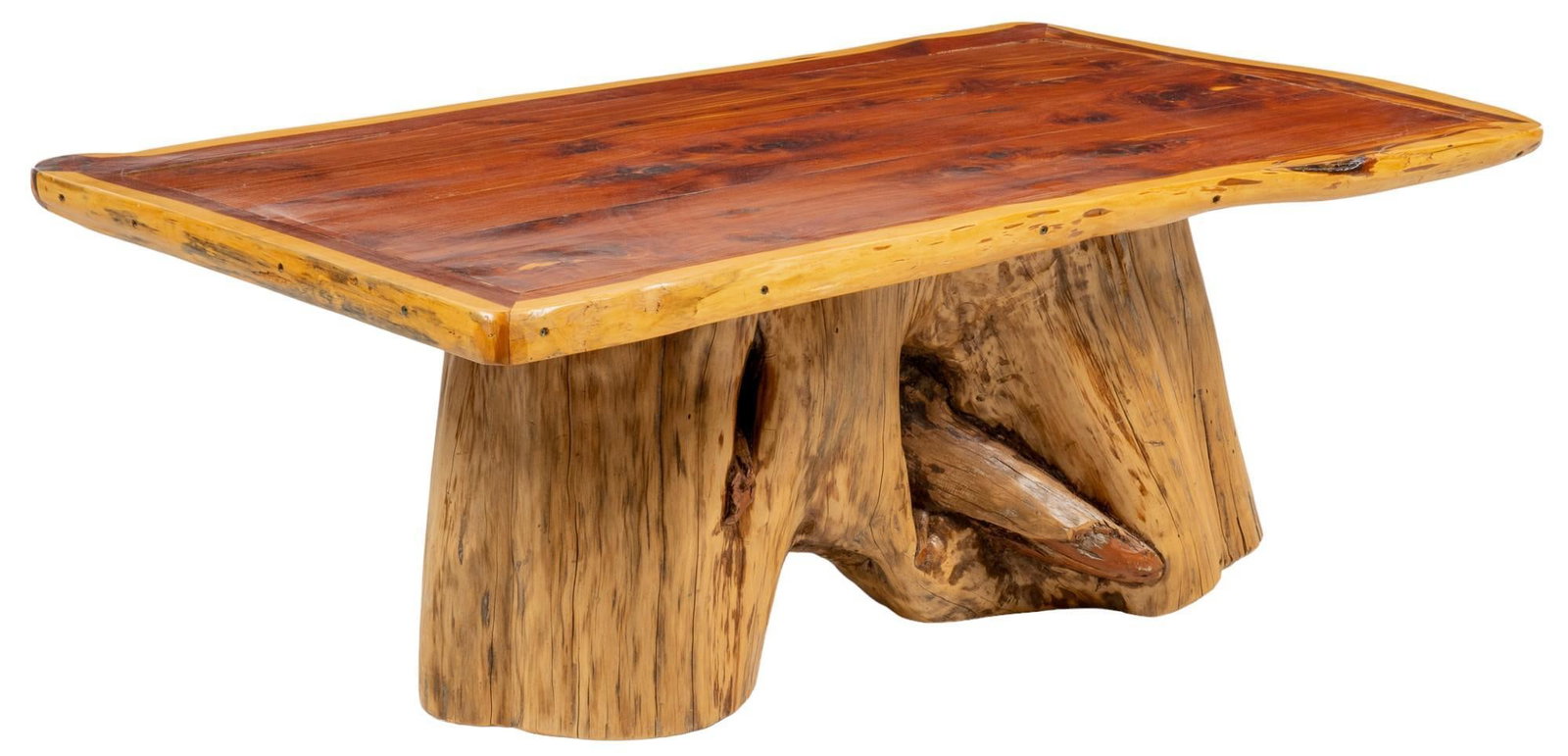 Live Edge Cedar Coffee Table: Live edge cedar coffee table with rectangular top, supported on cedar tree trunk base height 20 in. x width 54.5 in. x depth 32.5 in. Provenance: Property from the monumental lifetime collection of a 