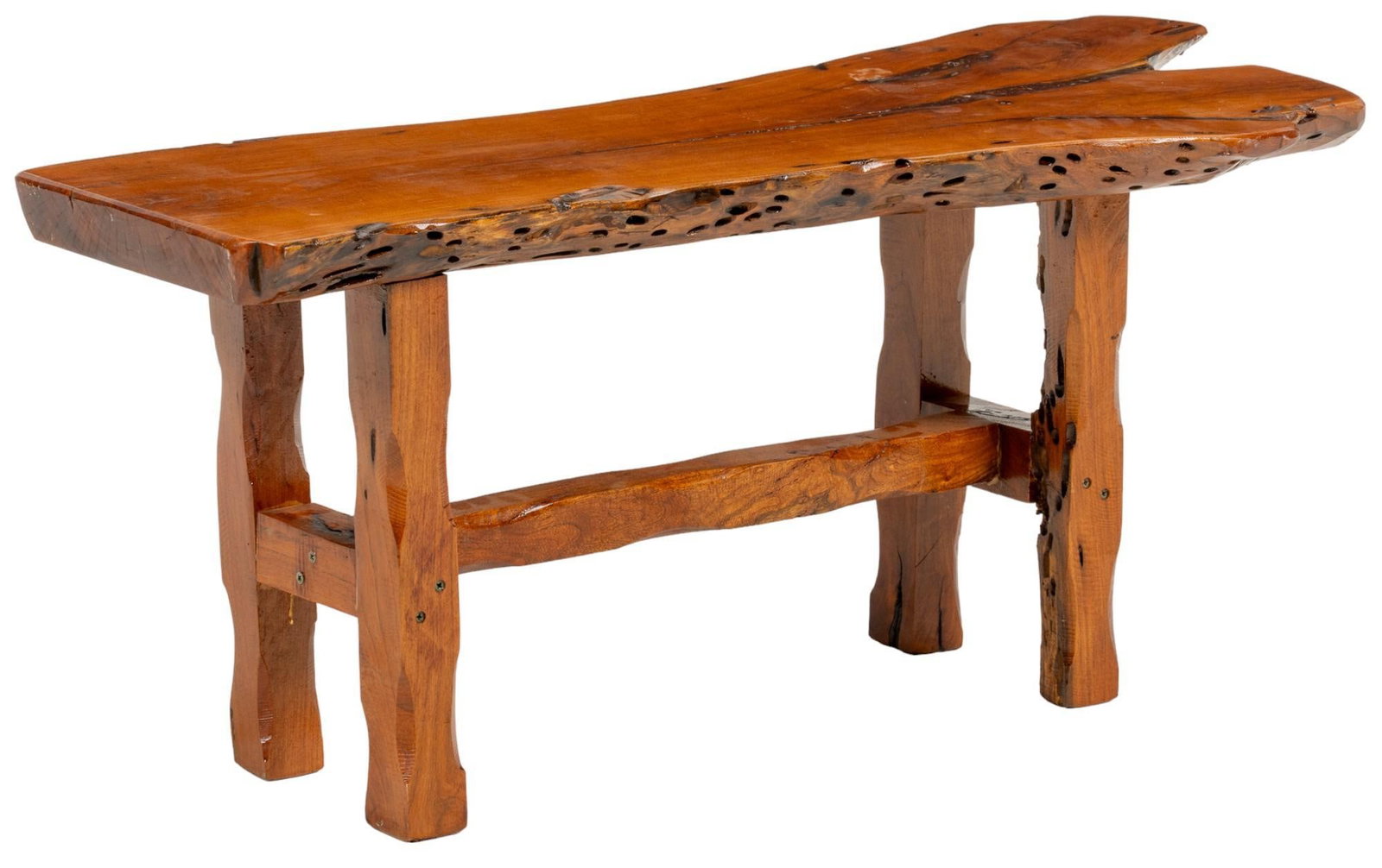 Live Edge Bench: Live edge wooden bench, featuring organically shaped seat, supported on carved post legs, with stretcher, and metal nail joinery height 18 in. x width 43 in. x depth 18 in. Provenance: Property from t