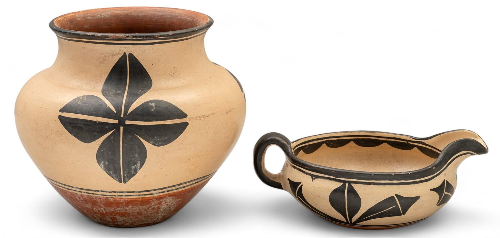(2) Pieces of Santo Domingo Pueblo Style Pottery: Two pieces of Santo Domingo Pueblo (Kewa) style pottery, includes one vase, and one sauce boat height 11 in. x diameter 11 in. / vase Shipping available for this lot through our partner 4CL; please re