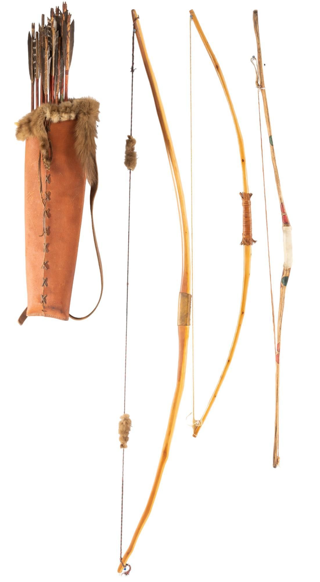 (3) Bows and (1) Leather and Fur Quiver: Three bows and one leather and fur quiver with arrows, Native American style, three wood bows with leather hand holds, brown leather quiver lined with animal fur, includes set of arrows with projectil