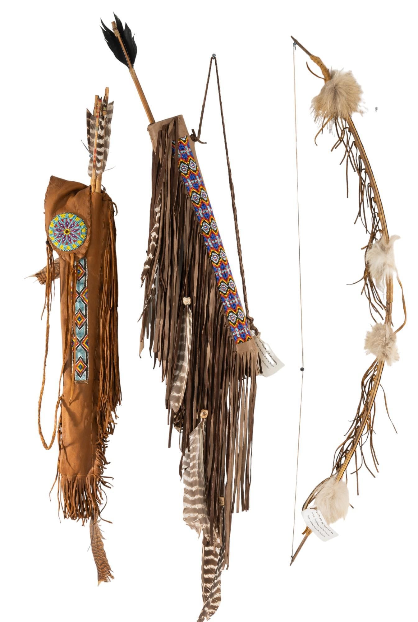 Native American Set of Matching Beaded Deer Leather bow and Quiver with Second Quiver: Native American set of matching bow and quiver, and second beaded quiver, matching pair has geometric beaded pattern, feathers, and fringe decorating deer leather quiver and bow, second quiver also ha