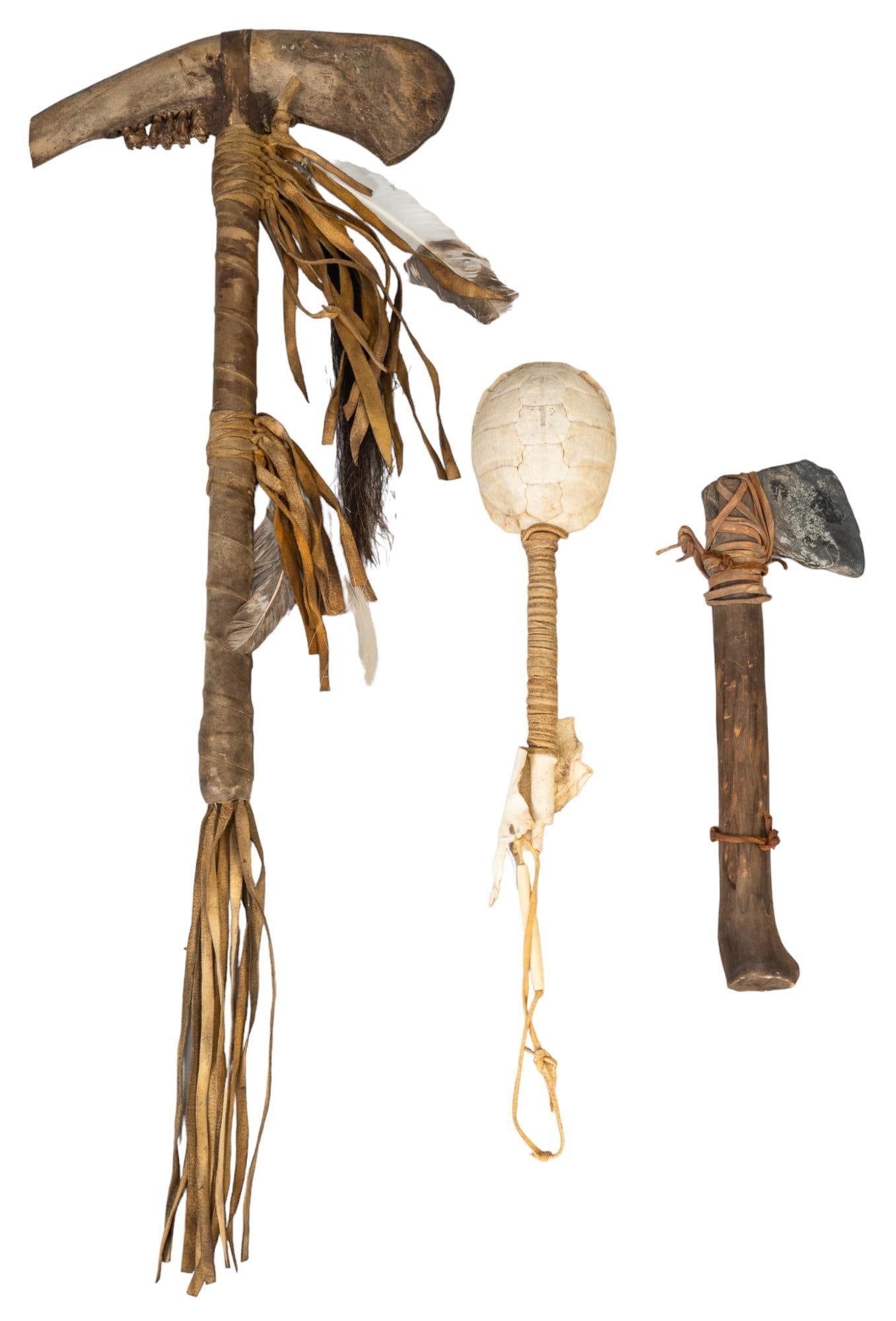 Collection of (3) Native American Style Tools: Collection of three Native American style tools, includes a turtle shell rattle with suede wrapped handle, stone axe, and buffalo jaw axe with deer leather, buffalo axe comes with authenticity certifi