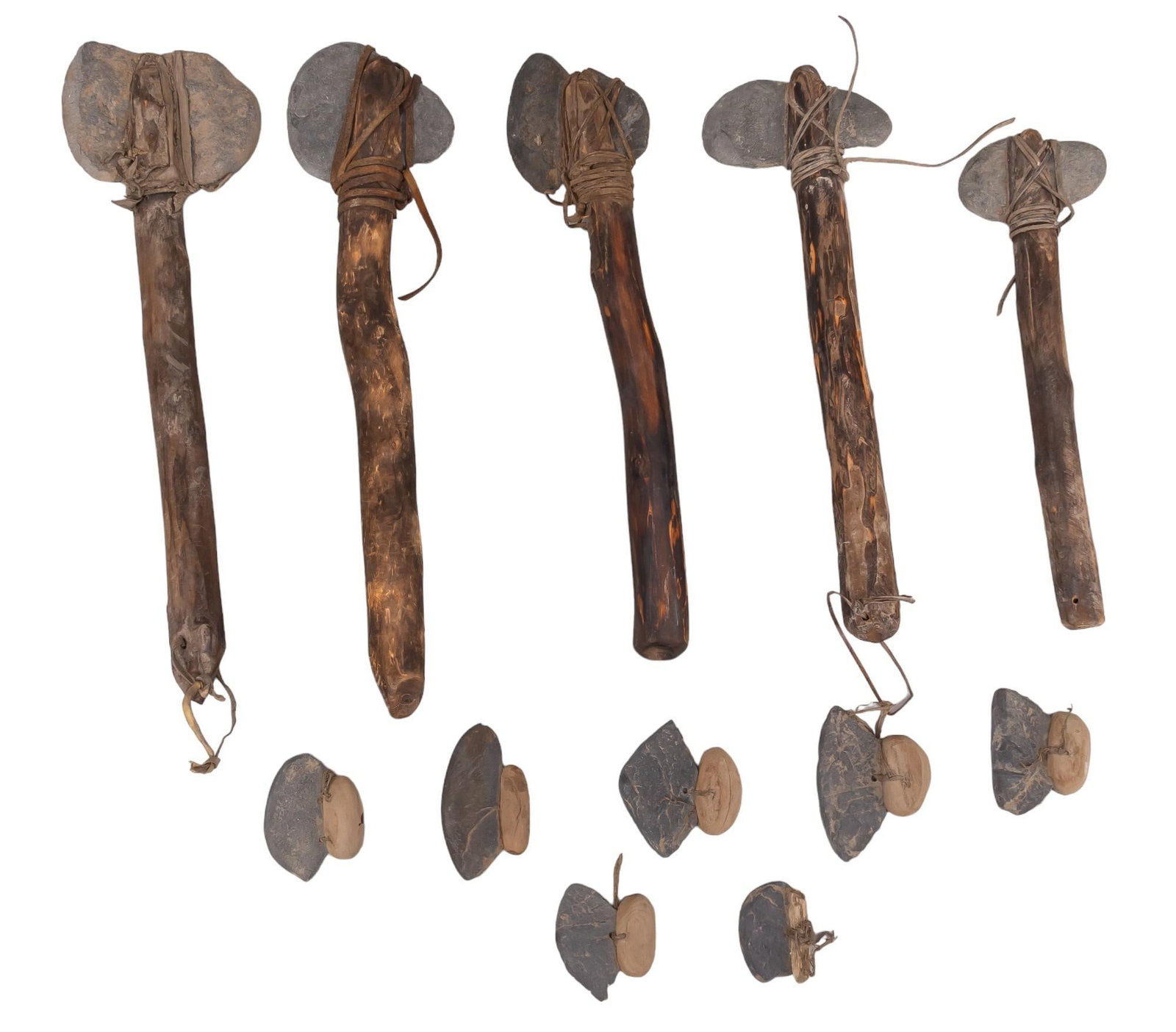 Collection of Wood and Stone Primitive Tools: Collection of wood and stone primitive tools, four large wood axes with stone heads attached with leather, seven small stone knives Provenance: Property from the monumental lifetime collection of a di