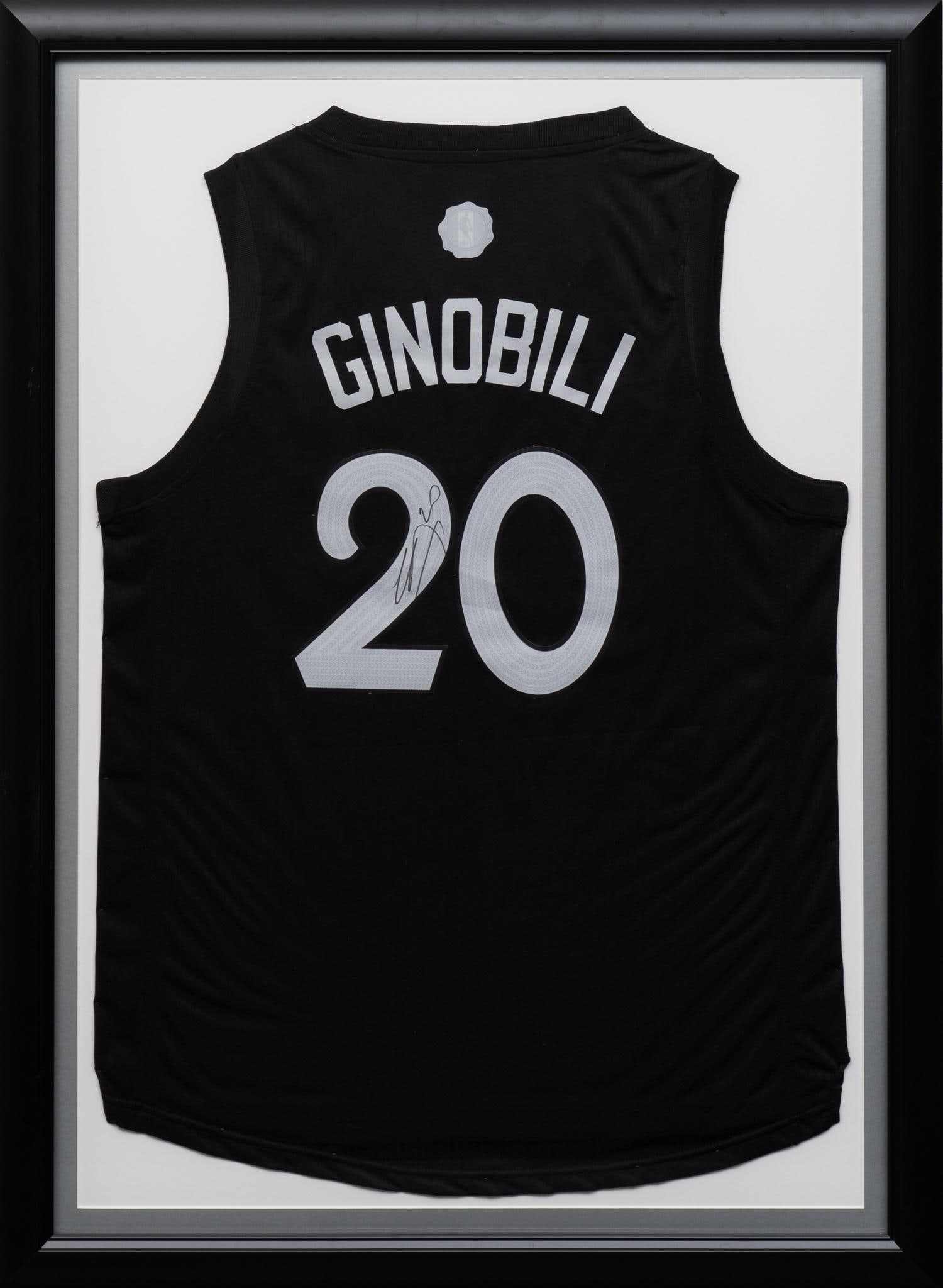 Manu Ginobli, Signed San Antonio Spurs Jersey: Manu Ginobili signed San Antonio Spurs basketball team jersey, framed height 43 in. x width 33 in. Provenance: Property from the estate of a Vero Beach, Florida lady Shipping available for this lot th