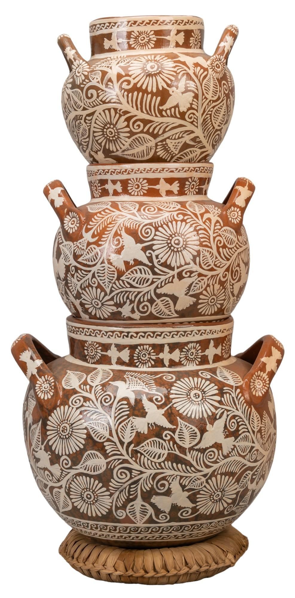 Cecilia Cuiriz Morales (b. 1956, Tzintzuntzan, Michoacan), Stacking Pots: Cecilia Cuiriz Morales (b. 1956, Tzintzuntzan, Michoacan), tower of pots, with burnished slip gaze, slip glaze hummingbird and flower motifs total / height 28 in. x width 15 in. x depth 14.5 in. large