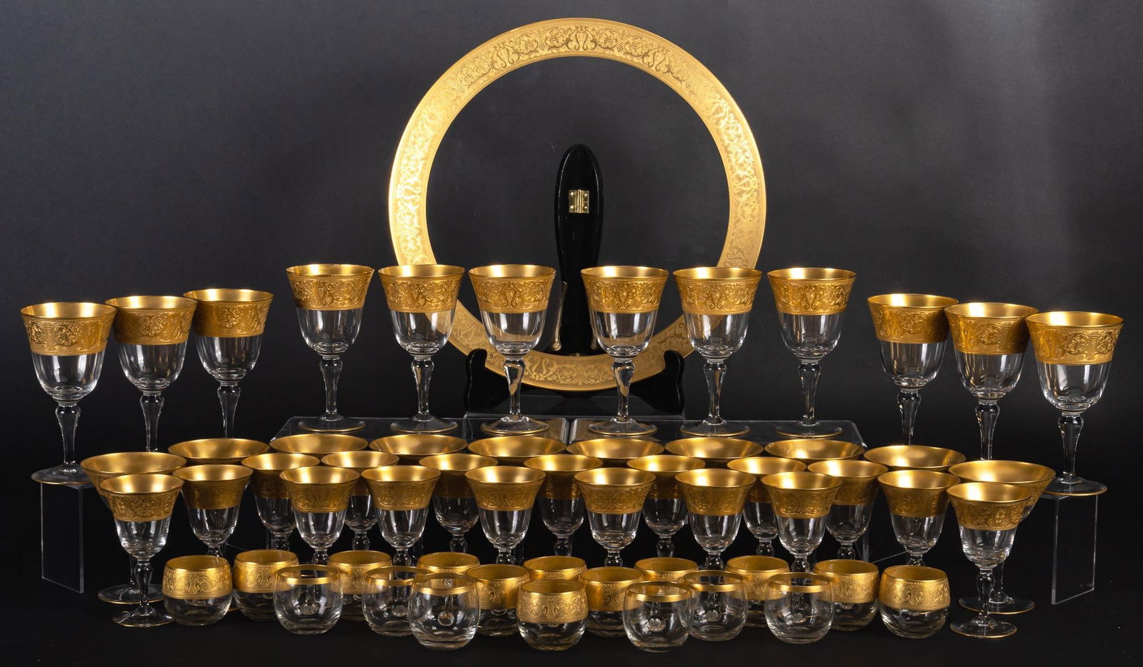 Vikki Carr | Glastonbury-Lotus "Georgian Gold" Glassware: Set of fifty two (52) pieces of Glastonbury-Lotus glassware in the "Georgian Gold" pattern, each with tooled parcel gilt rim with scrolling foliate detailing, set comprising of: (17) wine gl