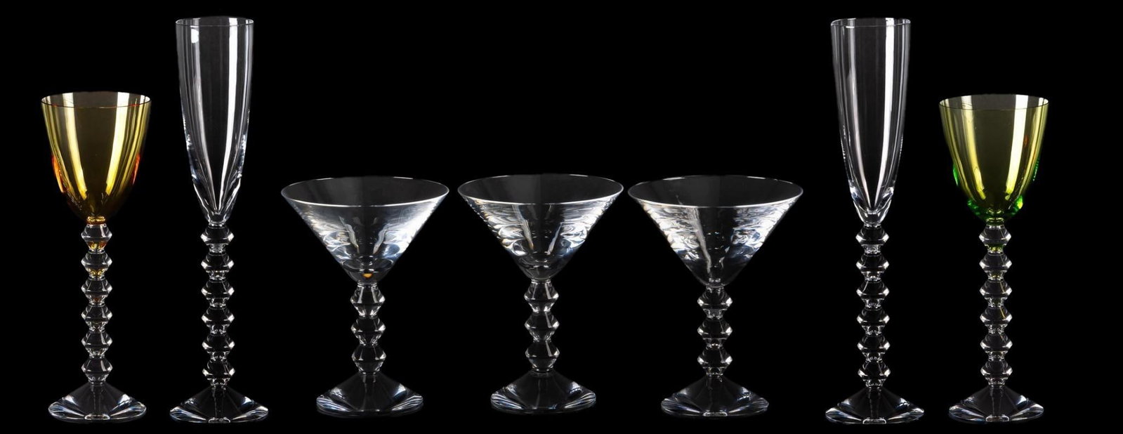 Vikki Carr | Baccarat "Vega" Glassware: Assembled set of crystal stemware, seven (7) pieces in total, all "Vega" pattern by Baccarat (France), includes three martini glasses, pair of "Flutissimo flutes, and a pair of colored cry