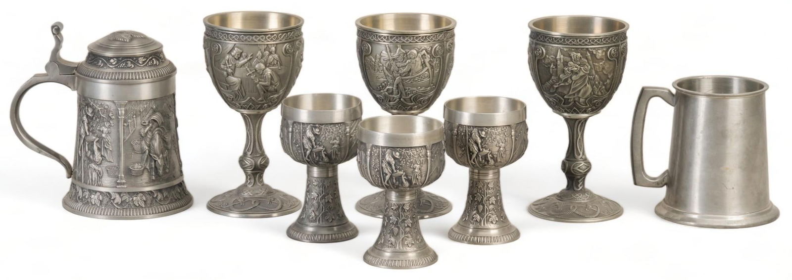 Vikki Carr | Collection of Pewterware: Collection of pewterware, eight (8) pieces in total, includes glass bottom tankard made in Sheffield (England), SKS Zinn (West Germany) pewter tankard with three (3) matching small wine goblets, and t
