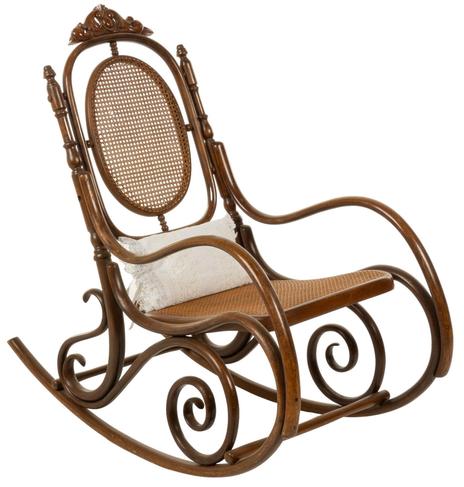 Vikki Carr | Bentwood Rocking Chair: Vintage bentwood rocking chair, after Thonet, with sleigh form scrolled frame, supporting cane oval form back and curved seat, central carved crest to top and turned accents throughout, with lace pill