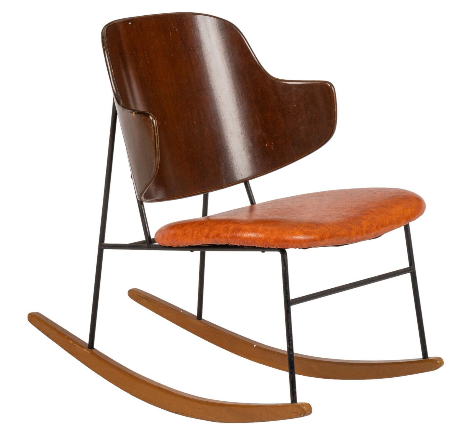 Ib Kofod-Larsen (1921-2003) for Christensen & Larsen (DNK) Penguin Rocking Chair: Ib Kofod-Larsen (1921-2003) for Christensen & Larsen (Denmark) Penguin rocking chair, featuring stylized wing back, over orange leather seat, supported on rockers height 30 in. x width 21 in. x de