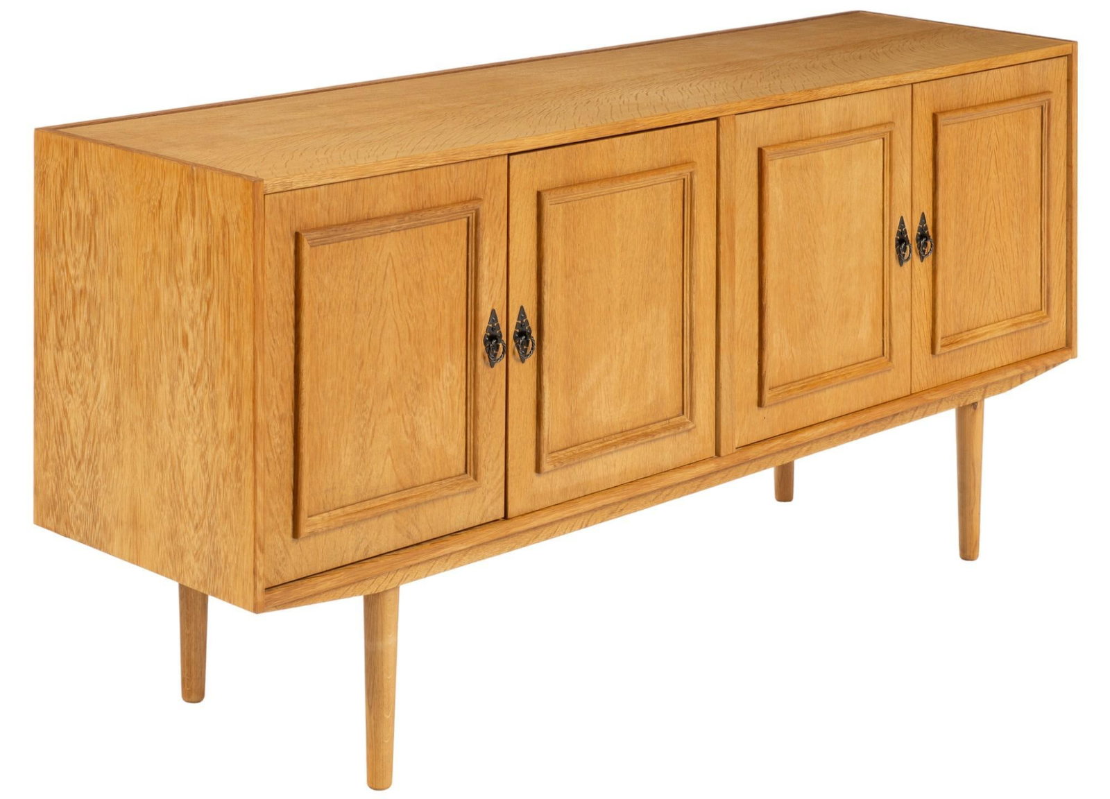Danish Mid-Century Credenza: Danish mid-century oak credenza featuring four carved wood doors with metal pulls opening to two interior storage areas with two shelves each height 30.5 in. x width 66.5 in. x depth 17.5 in. Shipping