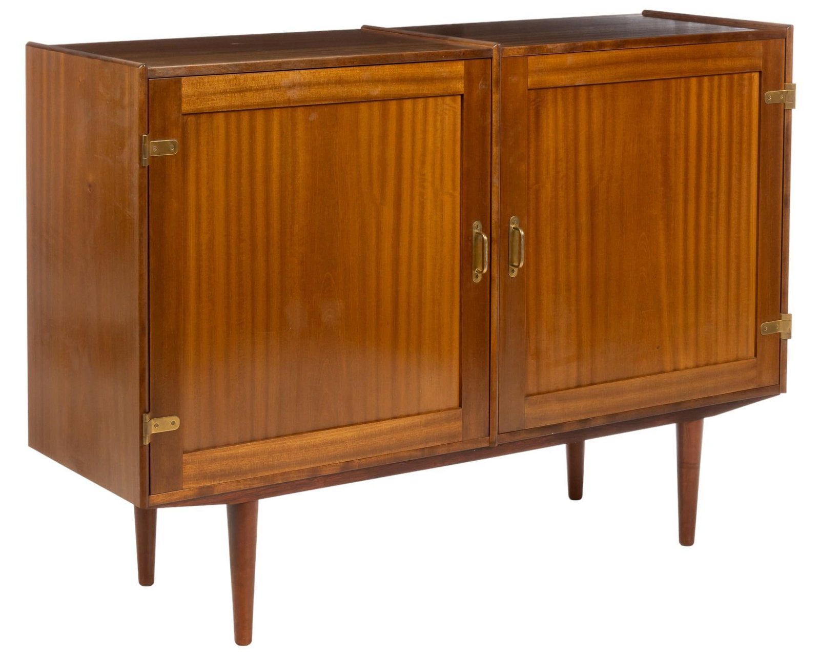 Danish Mid-Century Credenza: Danish mid-century credenza, featuring two doors with metal pulls opening to two interior storage areas, one with two shelves on with three shelves, on pin legs height 38.5 in. x width 54 in. x depth 