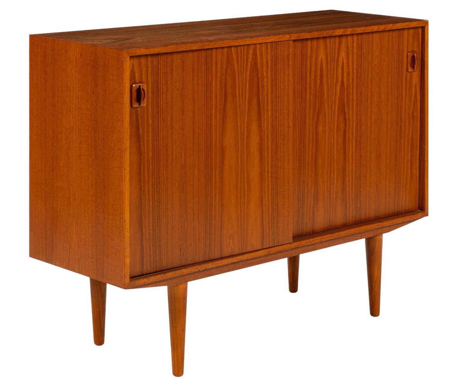 Danish Mid-Century Credenza: Danish mid-century teak credenza featuring two sliding doors with integrated wood pulls, opening to two interior storage spaces with two shelves height 34.5 in. x width 48 in. x depth 16 in. Condition