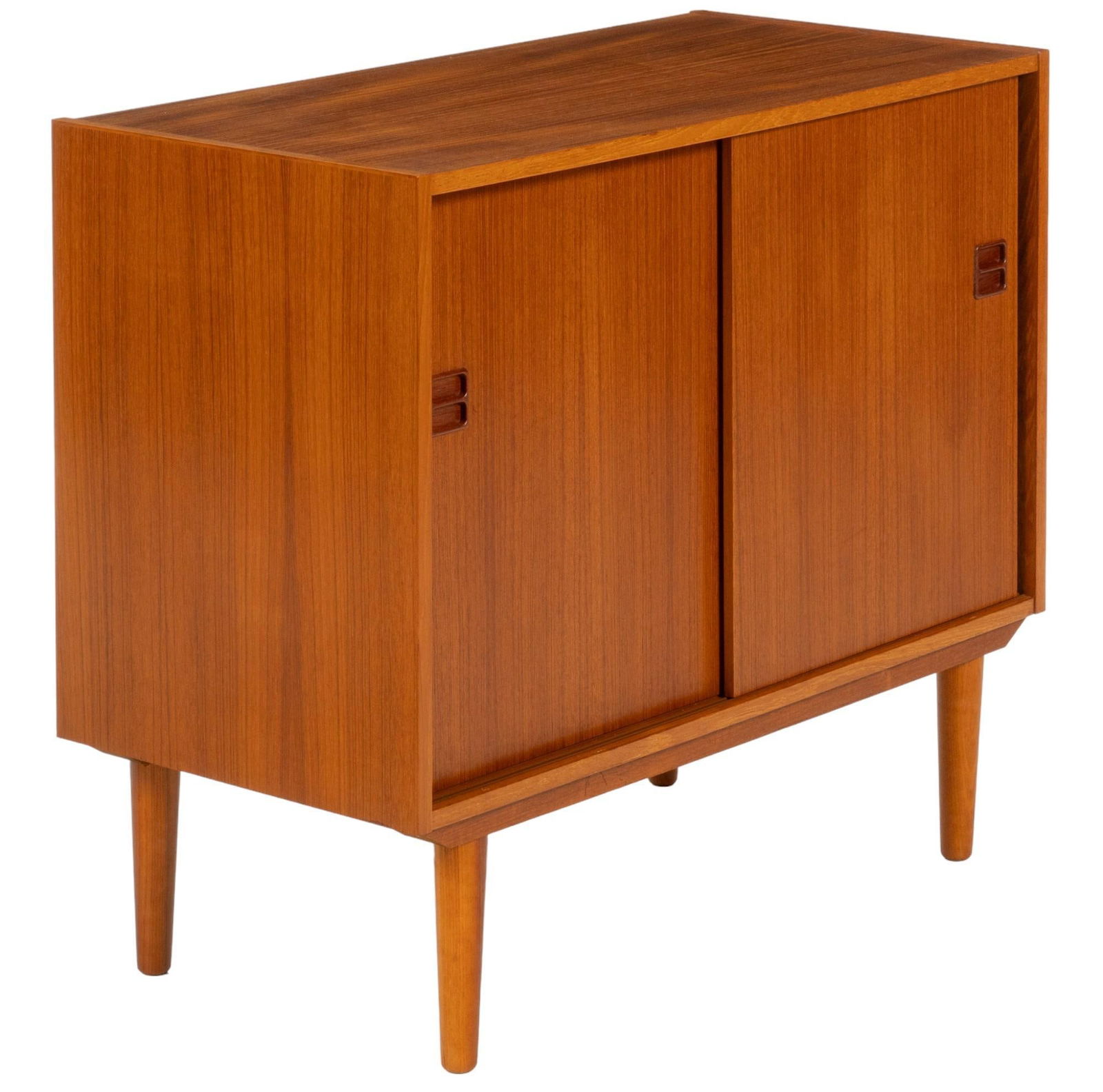 Danish Mid-Century Cabinet: Danish mid-century teak cabinet featuring two sliding doors with integrated wood pulls opening to one adjustable shelf height 30 in. x width 34.5 in. x depth 17 in. Shipping available for this lot t