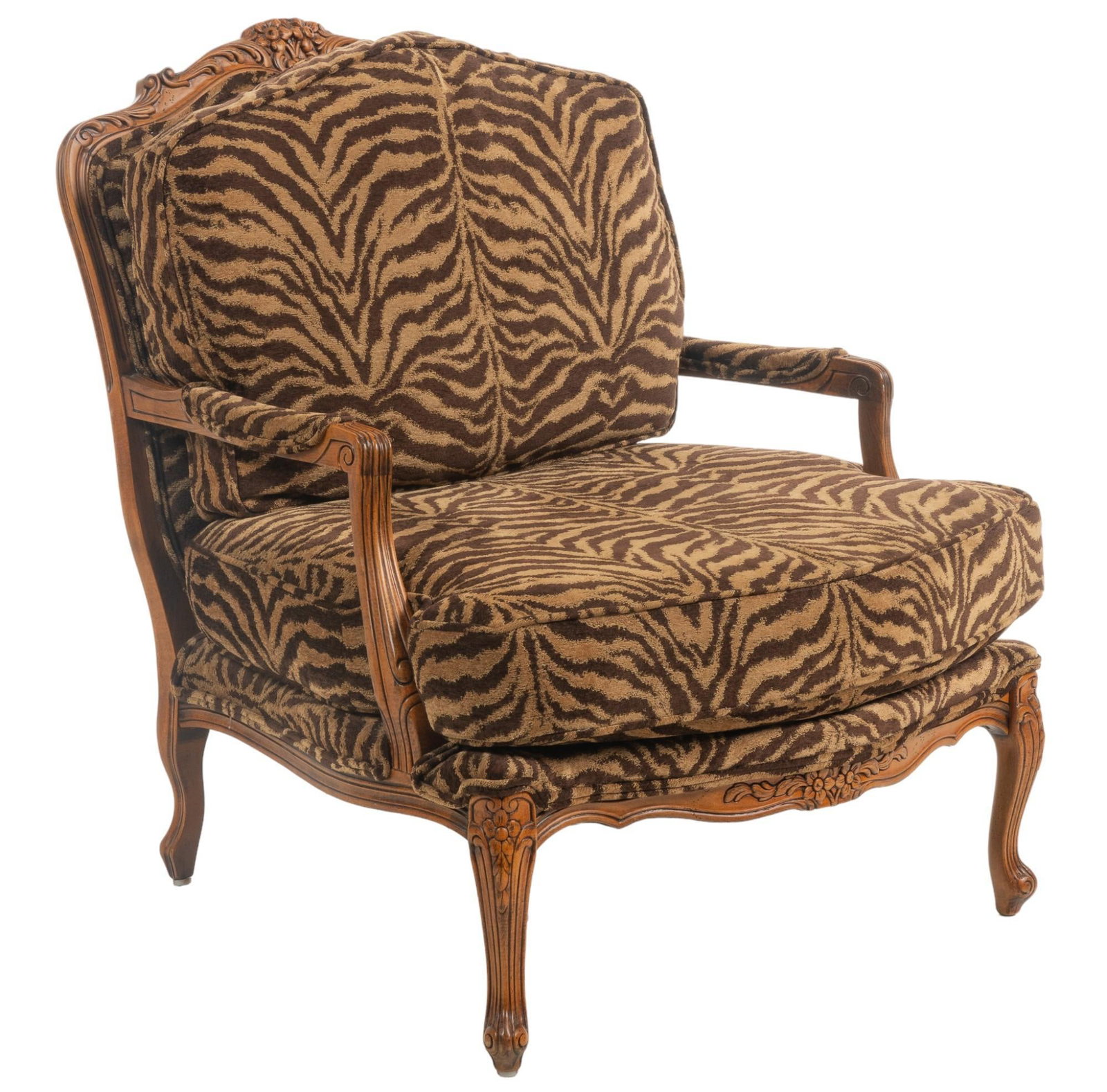 French Style Animal Print Armchair: French style animal print armchair, featuring carved wooden crest and apron with floral and scrolled motifs, with thick back and seat cushions in animal print fabric, supported on cabriole legs height