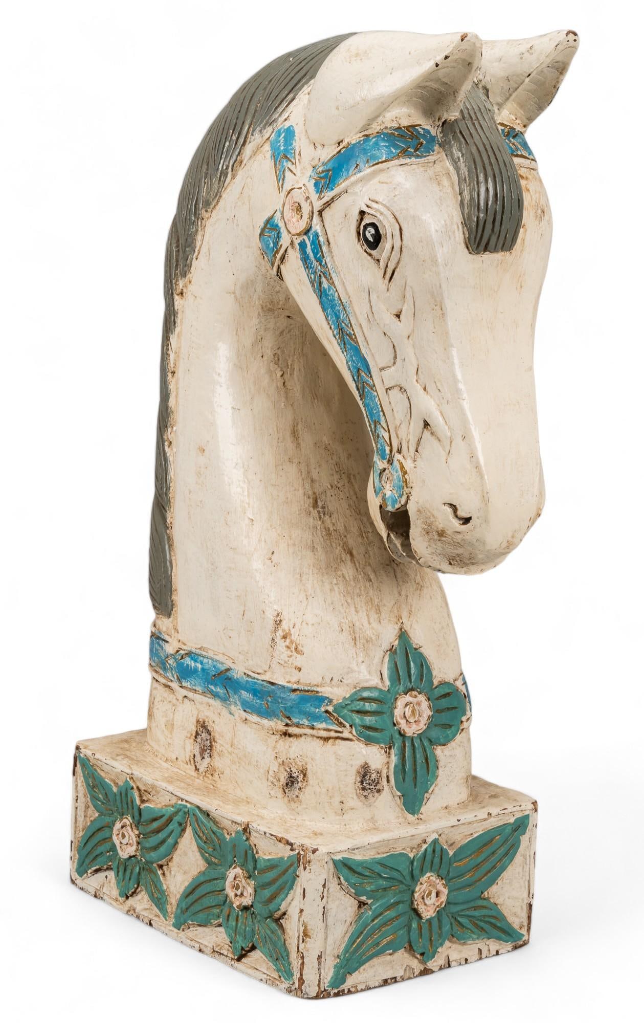 Vintage Horse Head Sculpture: Vintage horse head sculpture, carved wood, with polychrome paint remnants, circa early to mid 20th century height 27 in. x width 9 in. x depth 12.5 in. Provenance: Property from a San Antonio, Texas g