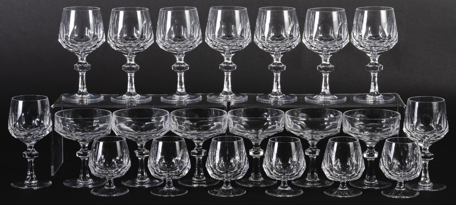 Set of (21) Nachtmann "Alexandria" Crystal: Set of twenty Nachtmann "Alexandria" crystal, includes (6) brandy glasses, (6) champagne / tall sherbert glasses, (7) burgundy wine glasses, and (2) claret wine glasses height 6 3/4 in. / burg