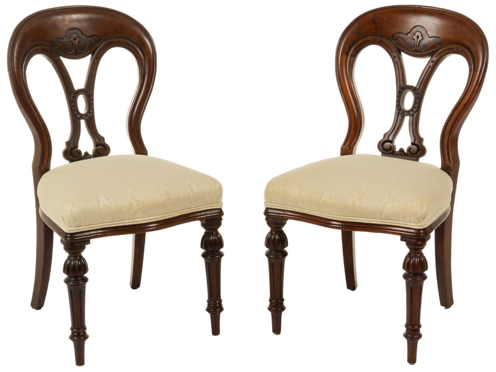 Pair of Balloon Chairs: Pair of balloon back chairs, with carved wooden frame, and cushioned set with cream colored fabric upholstery, supported on turned and fluted legs height 36 in. x width 20 in. x depth 23 in. / each