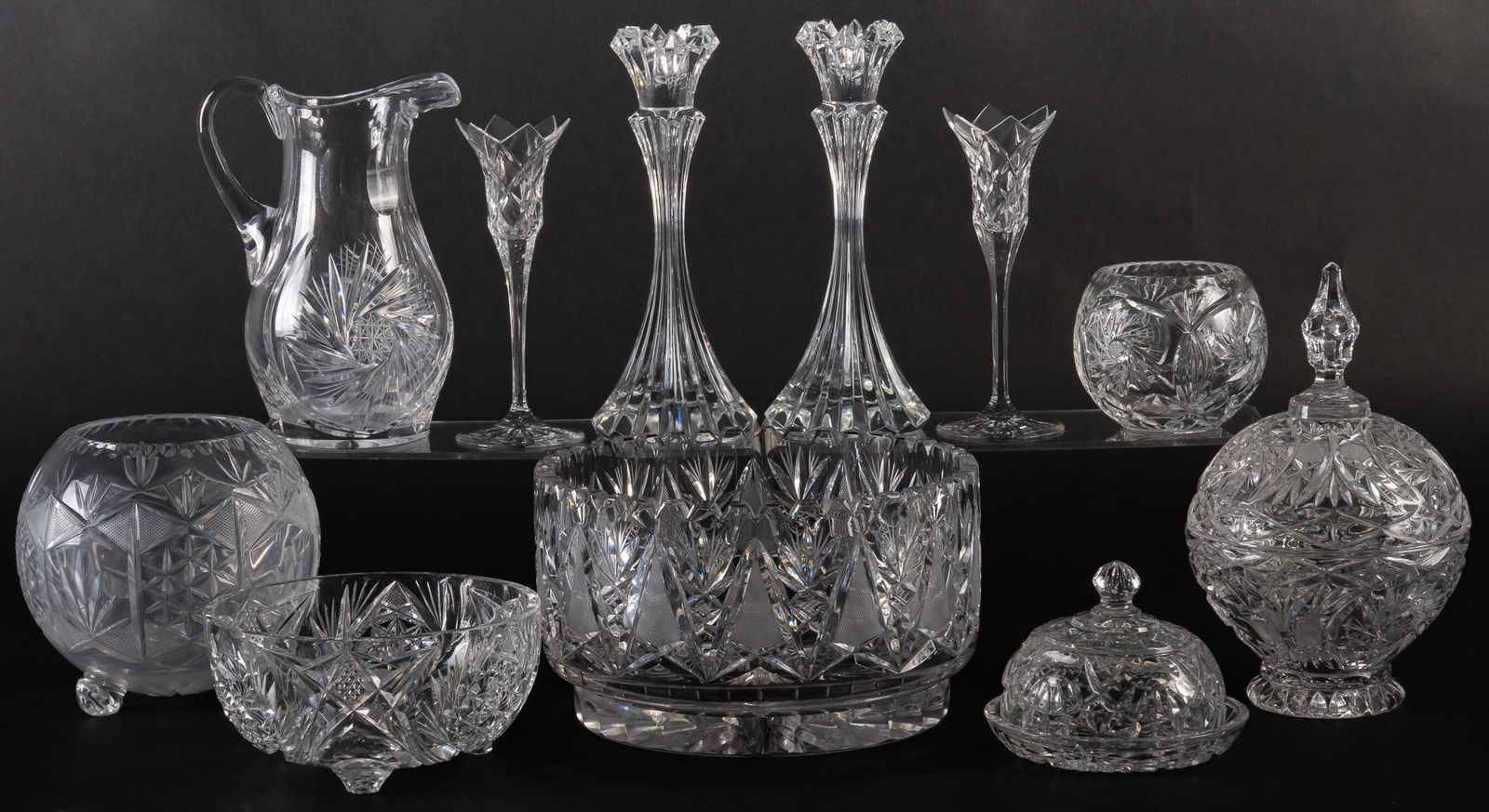 Group of (11) Vintage Crystal Decorative Objects: Collection of vintage crystal decor, eleven pieces, includes one pitcher, two pairs of candlesticks, one rose bowl, one footed rose bowl, three bowls of various sizes with one lidded, and one lidded d