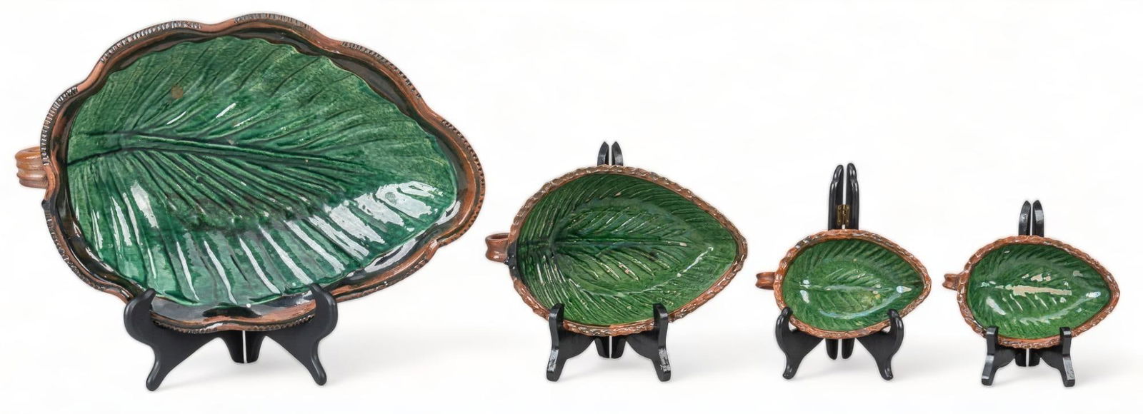 (4) Michoacan Greenware Nesting Bowls: Set of (4) Michoacan greenware nesting bowls, modeled clay, in the form of leaves, with glazed interior, unglazed exterior height 3 in. x width 16.5 in. x depth 1 in./ largest Provenance: Property f