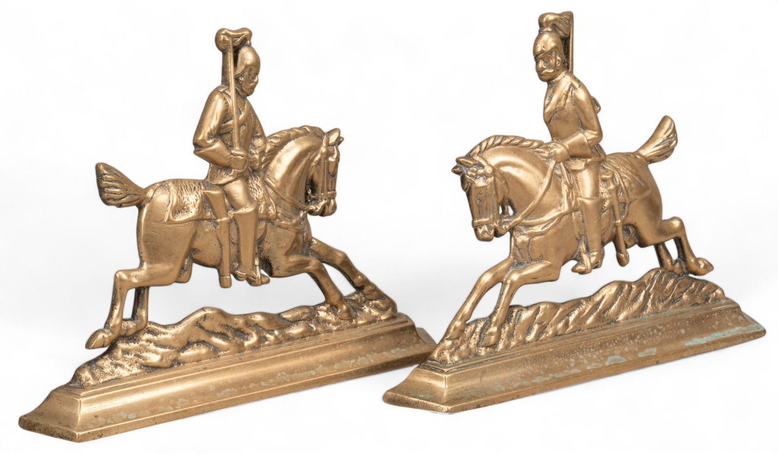 Pair of English Andrion Ends: Pair of gold-toned brass English andiron ends height 10 in. x width 11 in. x depth 2 in. Shipping available for this lot through our partner 4CL; please request a shipping quote at shipping@vog