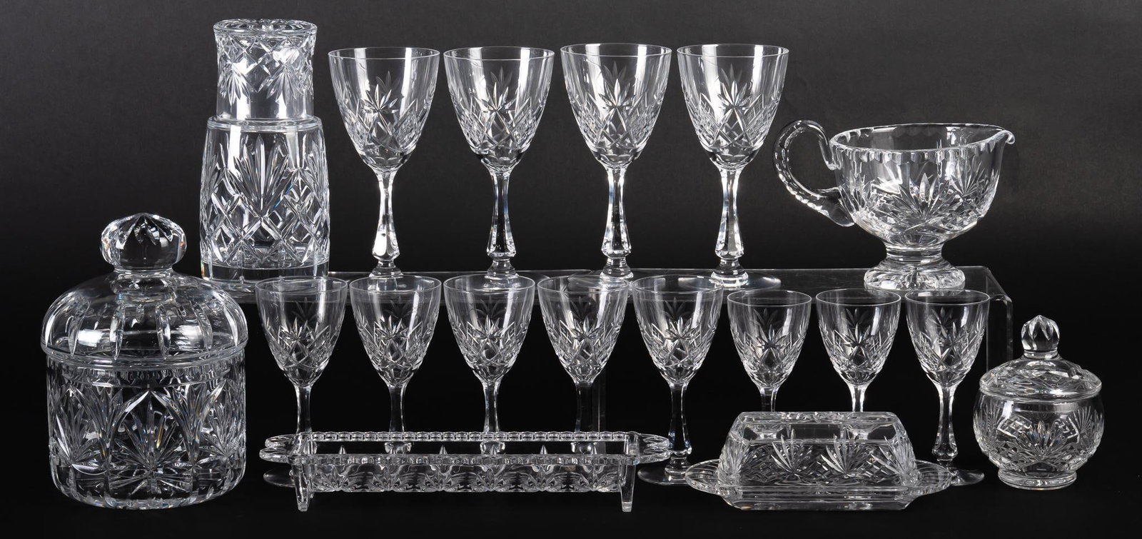 Collection of Vintage Crystal: Collection of assorted vintage cut crystal, (18) pieces, to include two lidded jars / containers, one Rogska "Richmond" butter dish, one water carafe set, one gravy boat, one cracker tray, and