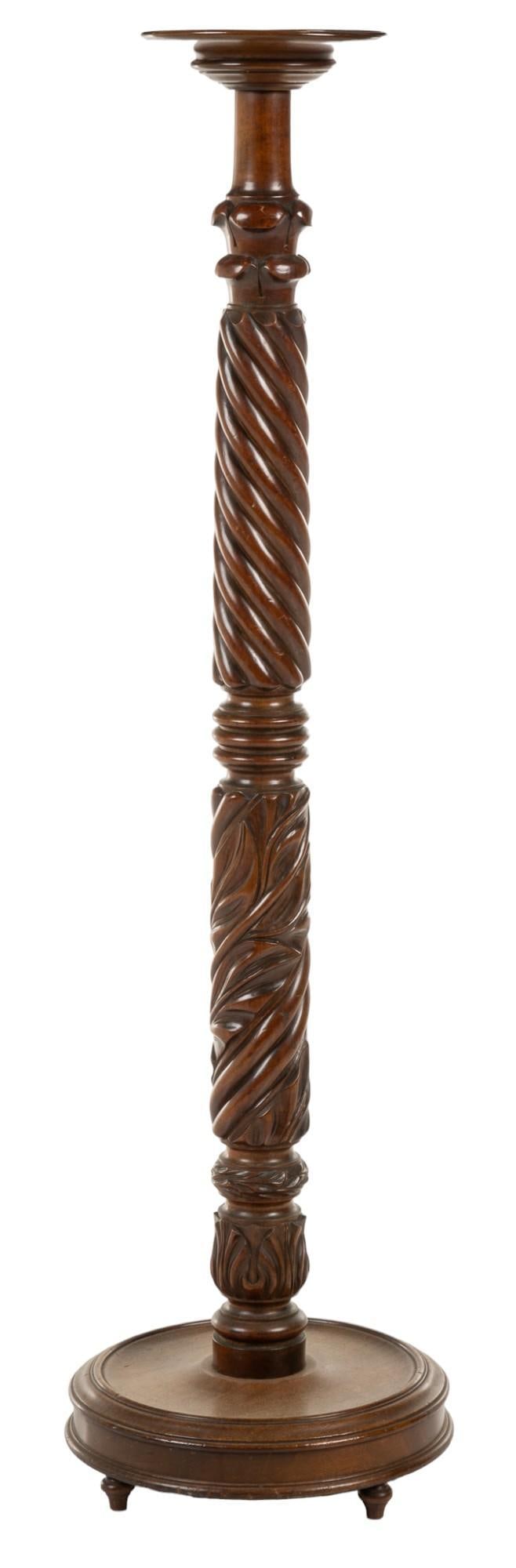 Carved Pedestal: Carved wooden pedestal with scroll and twist motifs height 55 in. x width 15 in. x depth 15 in. Provenance: Property from the personal collection of celebrated singer and philanthropist Vikki Carr Shi