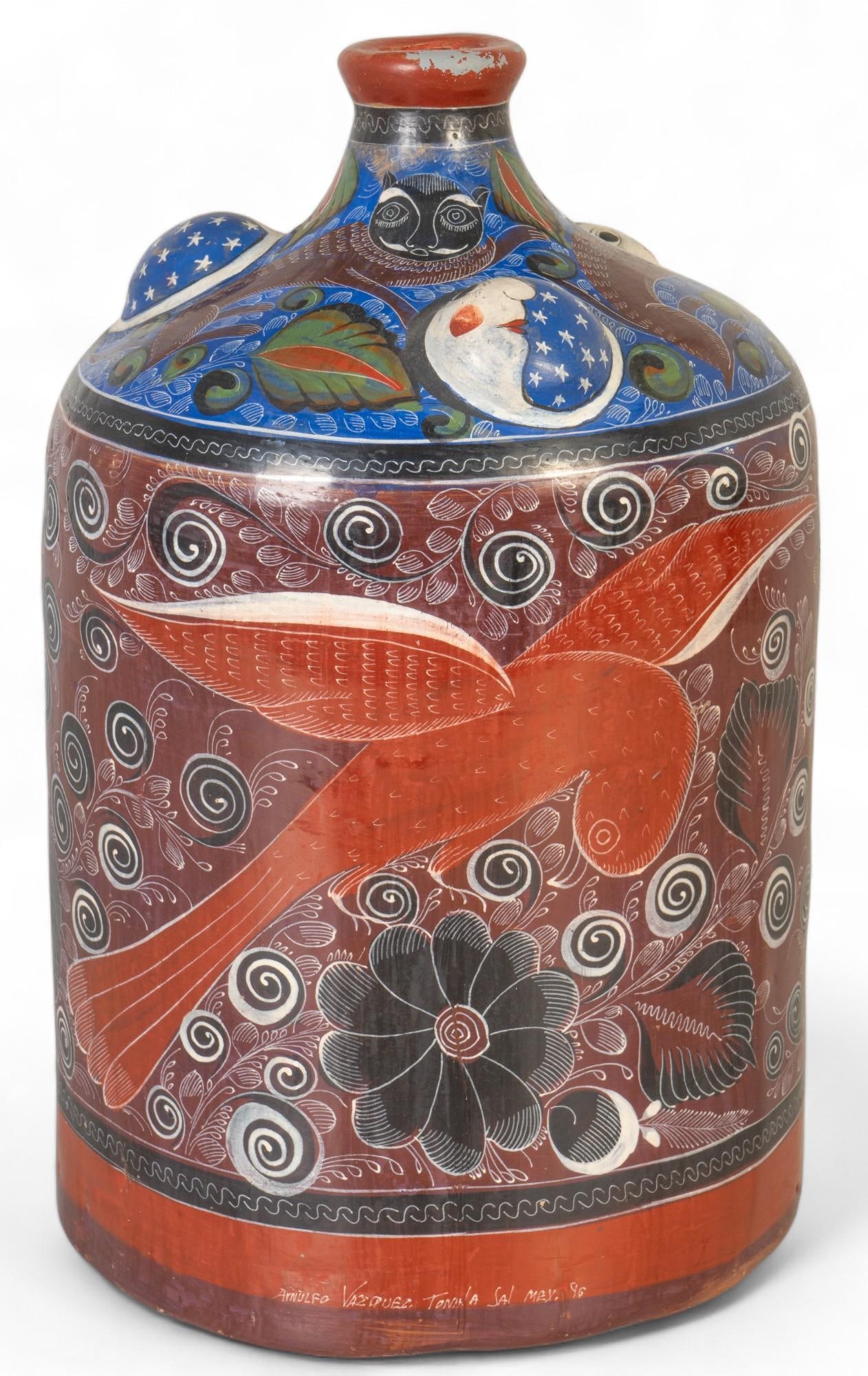 Arnulfo Vasquez (Tonala) Tonala Fluted Neck Vase: Arnulfo Vasquez (Tonala) fluted neck vase featuring bird and floral polychrome details, marked on base height 16 in. x width 10 in. x depth 10 in. Shipping available for this lot through our partner 4