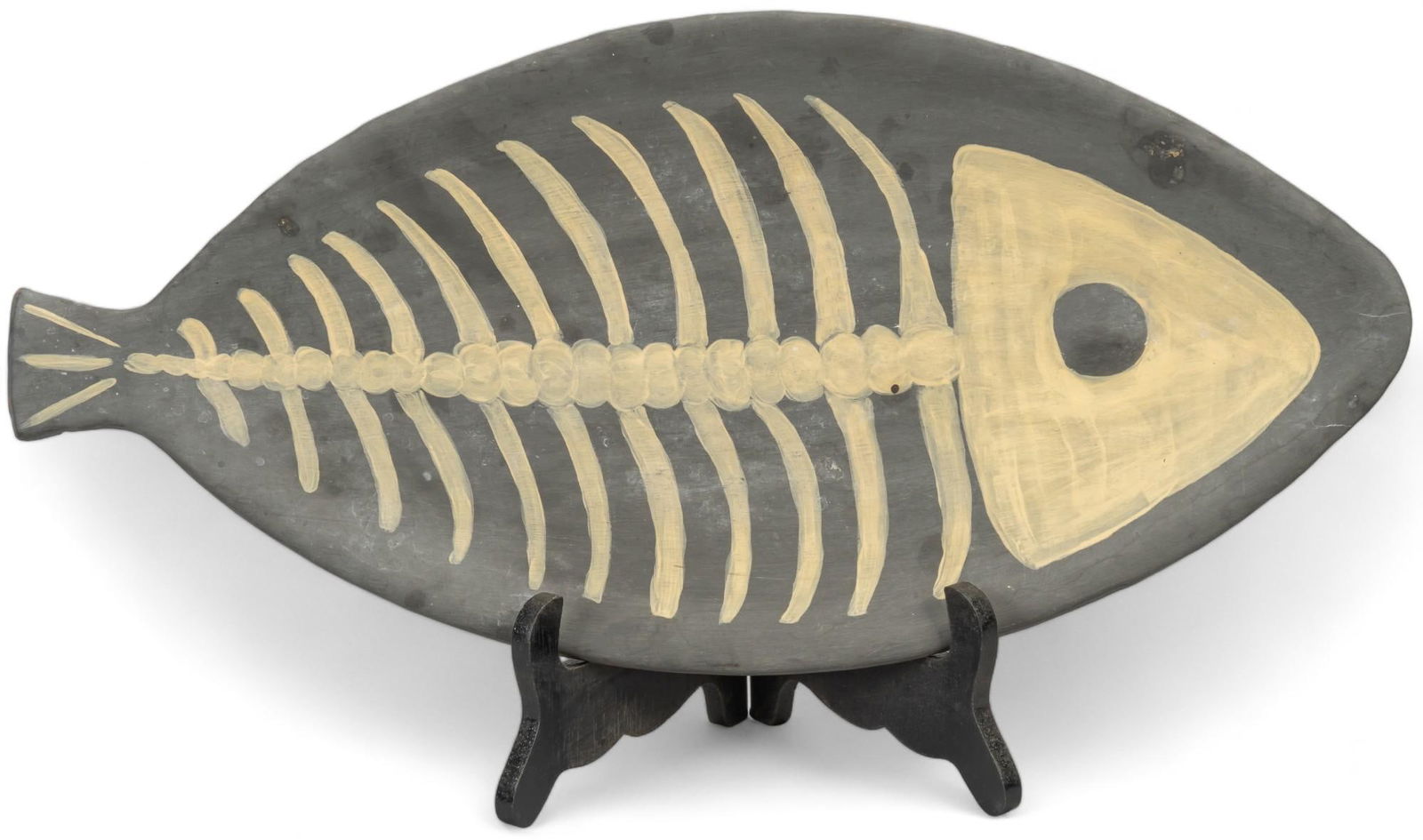 Ceramic Fish Bone Charger: Ceramic fish bone charger, signed Roze, from the Mujer Artes Clay Cooperative (San Antonio, Texas), marked on back height 0.5 in. x width 9 in. x depth 18.5 in. Shipping available for this lot thro