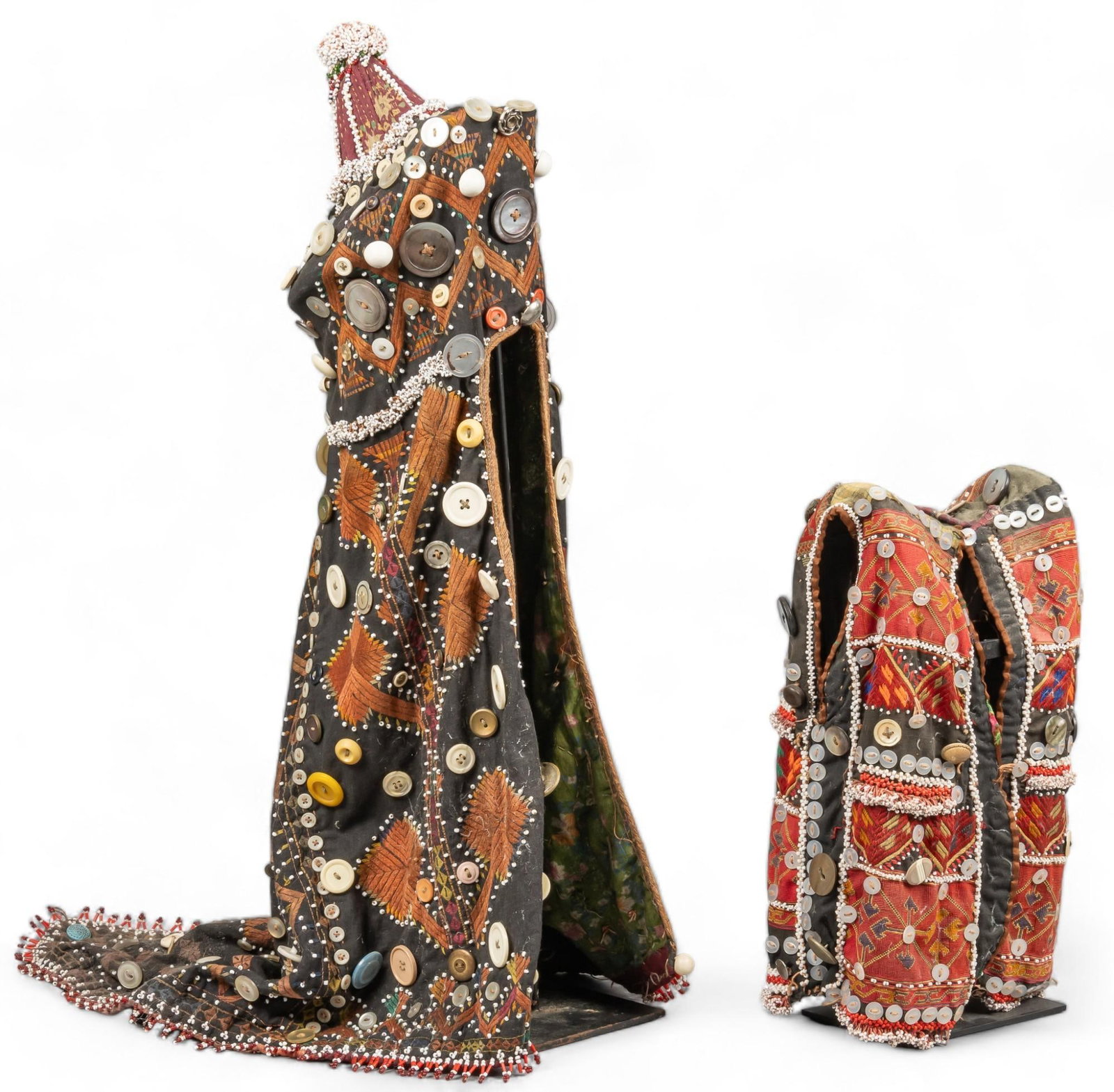 Kohistan Headdress and Child's Vest: Vintage Kohistan (Pakistan) beaded and buttoned headdress, and child's vest height 27.5 in. x width 11 in. x depth 20 in. / headdress Shipping available for this lot through our partner 4CL; pleas
