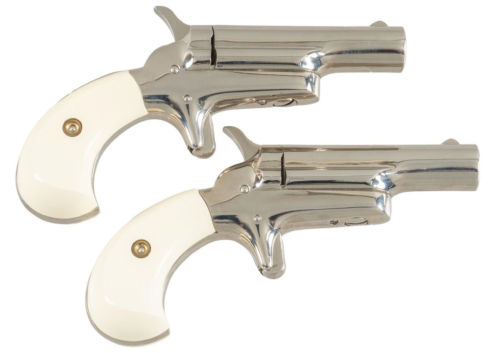 Cased Colt Bookcase 4th Model 22 Short Derringers: Serial: (1) 1336N; (2) 1337N Manufacturer: Colt's P.F.A. Mfg. Co. Inc. (c. early 1960s) Model: Bookcase 4th Model Derringer Caliber: 22 Short Barrel length: 2.5 in. OAL: 5 in. Condition: Good; syn