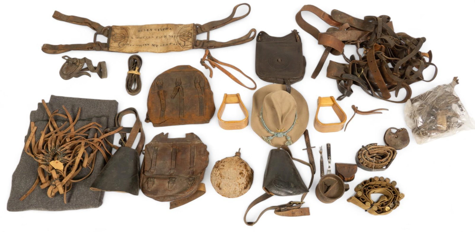 Lot of Miscellaneous US Cavalry Gear With Named Pieces: Includes: -Approximately 60 pieces of US Cavalry gear stirrups, tack; blanket -Model 1889 Campaign Hat Named to "Frank McKenzie" written on inside of band -(2) U.S. cartridge belts identified 