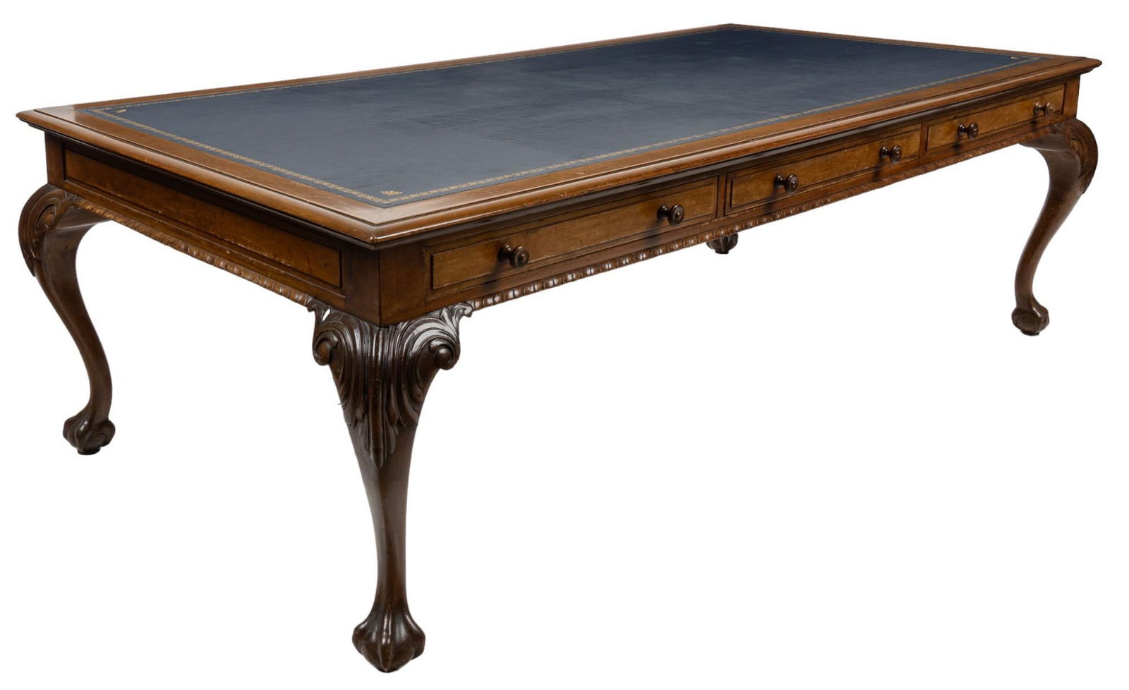 Executive Desk: Chippendale style desk featuring top inlaid with blue leather with gold details over three drawers with double wooden pulls, supported on four carved cabriole legs ending in claw and ball feet heigh
