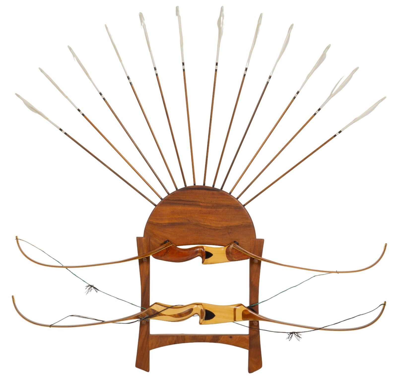 Bow and Arrow Rack Set: Bow and arrow rack set that includes wooden rack equipped with pair of wooden bows, and twelve arrows height 60 in. x width 60 in. x depth 5 in. Provenance: Property from the monumental lifetime co