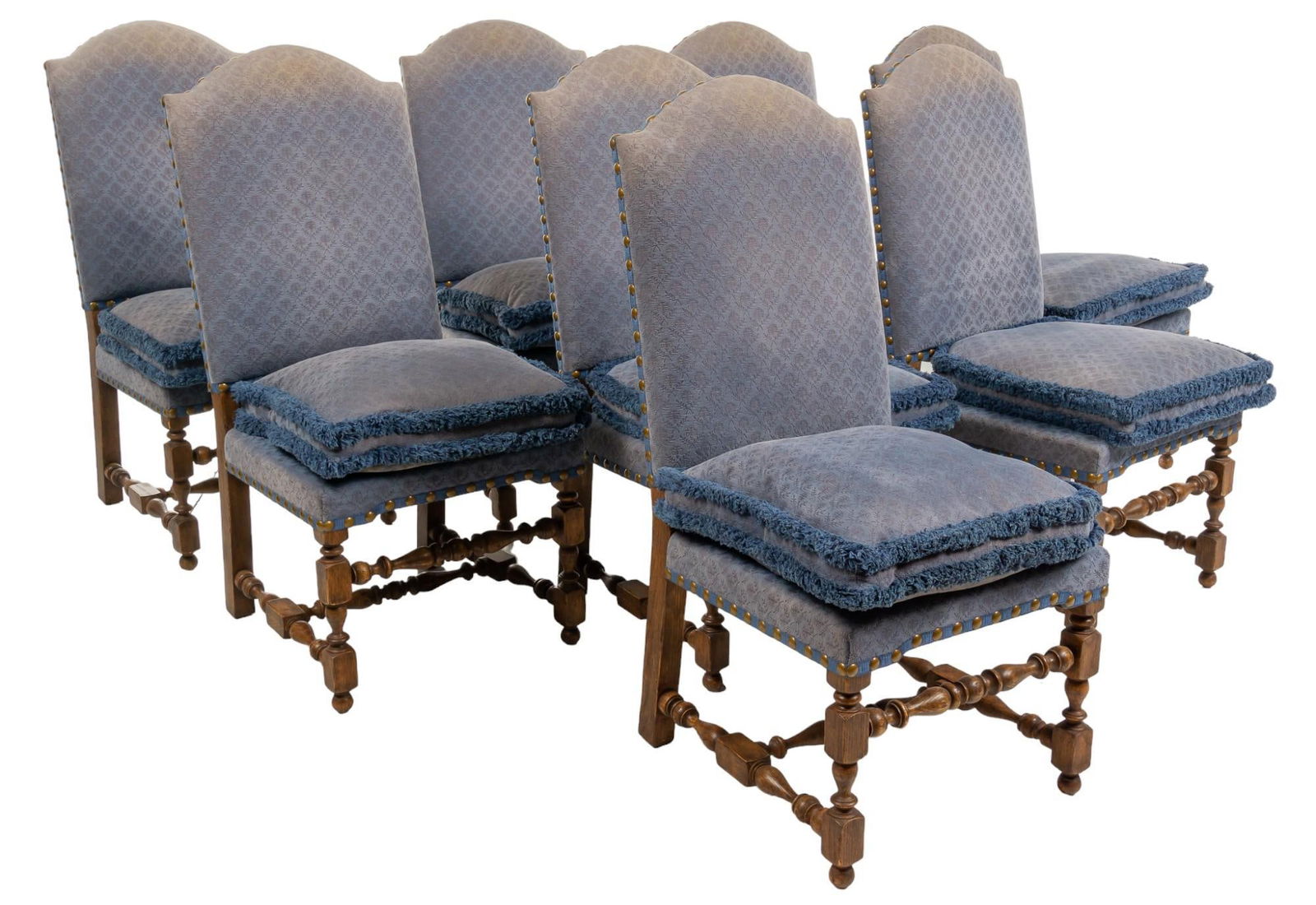 Set of (8) Wooden Chairs: Set of eight wooden chairs, with patterned blue fabric upholstery with metal rivet accents, with removable cushions, supported on turned legs with turned front and H-frame stretchers height 44 in. x