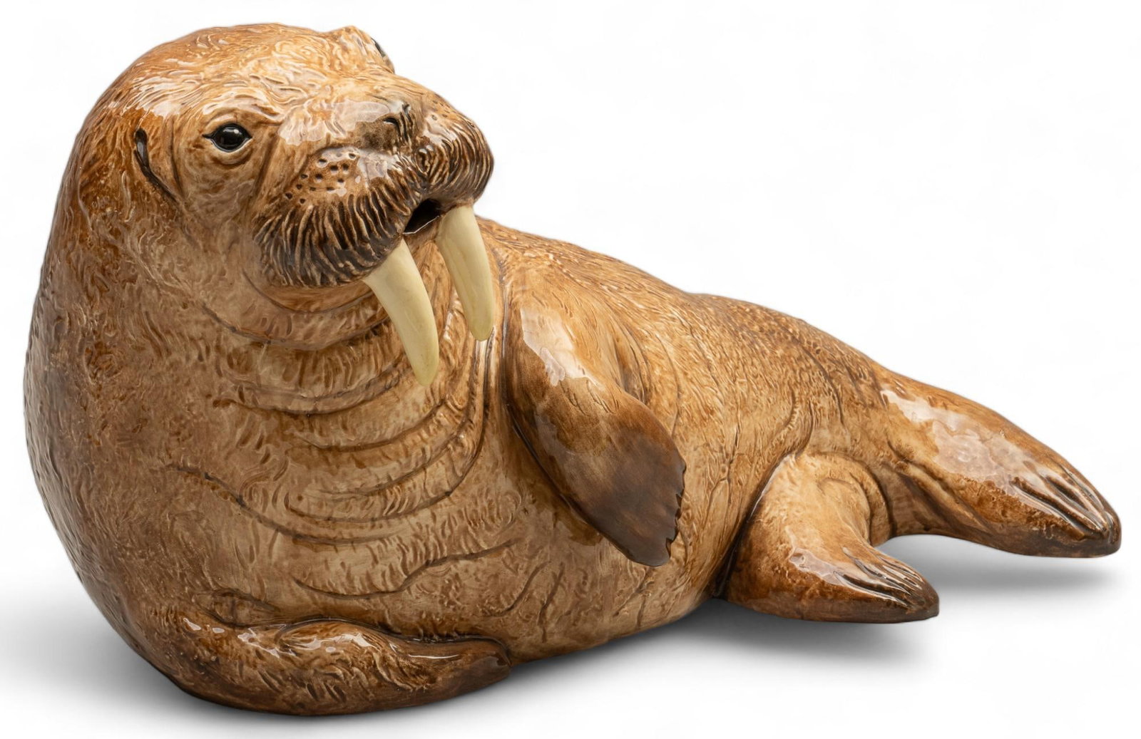 Ceramic Walrus Statue: Ceramic walrus statue height 11.5 in x width 20.5 in x depth 9.5 in Shipping available for this lot through our partner 4CL; please request a shipping quote at shipping@vogtauction.com or 210-971-