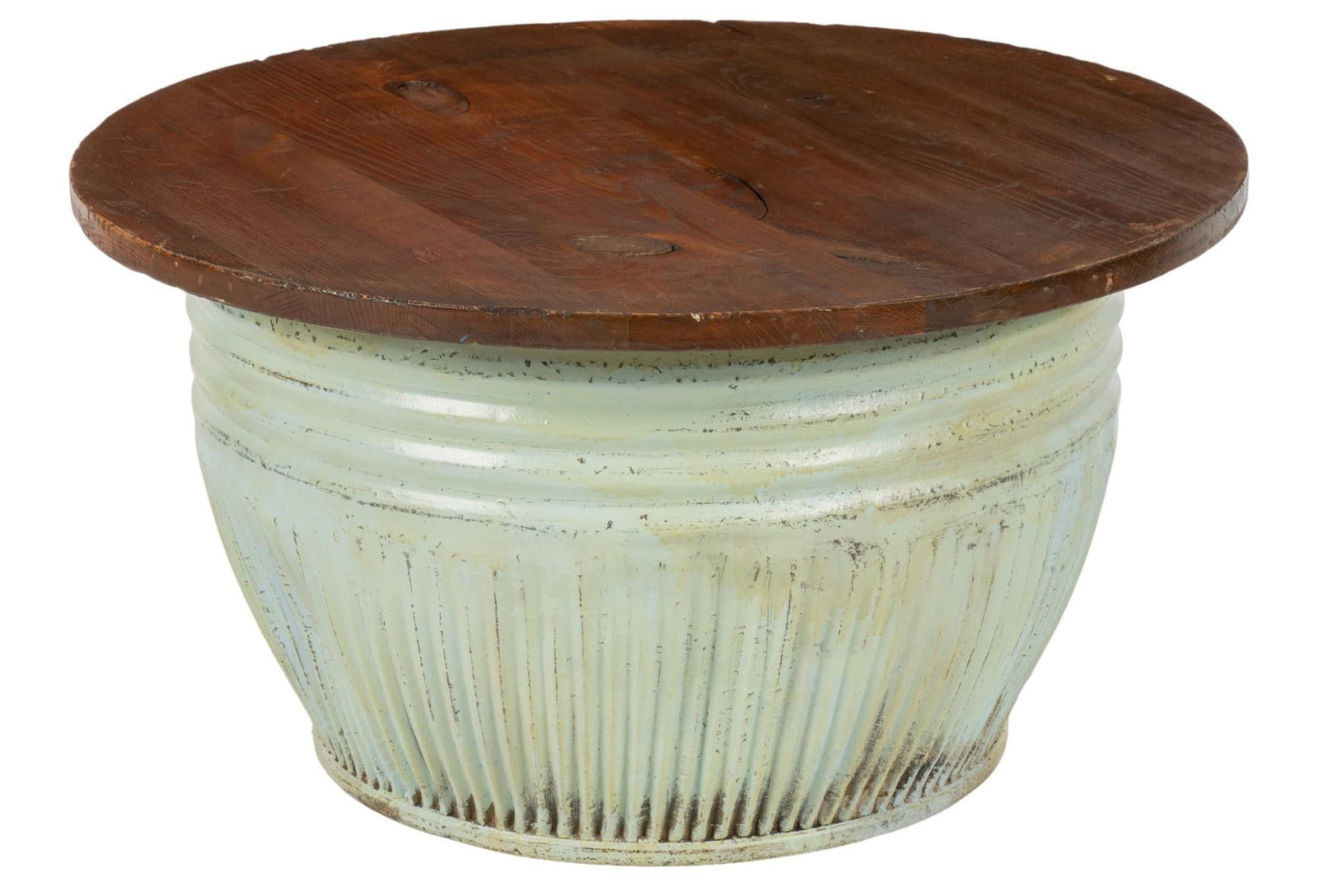 Rustic Table: Vintage table featuring finished circular wooden top supported on hollow metal urn base with fluted design height 21 in. x width 39 in. x depth 39 in. Shipping available for this lot through our partn