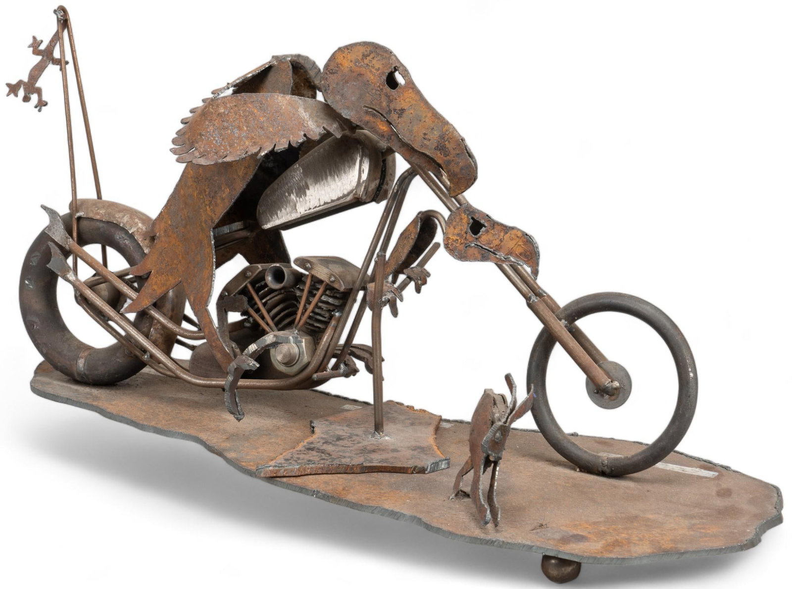 Metal Folk Art Sculpture: Metal folk art sculpture, featuring a buzzard on a motorcycle height 12 in. x width 24 in. x depth 10 in. Provenance: Property from the monumental lifetime collection of a distinguished Dallas, Texas 
