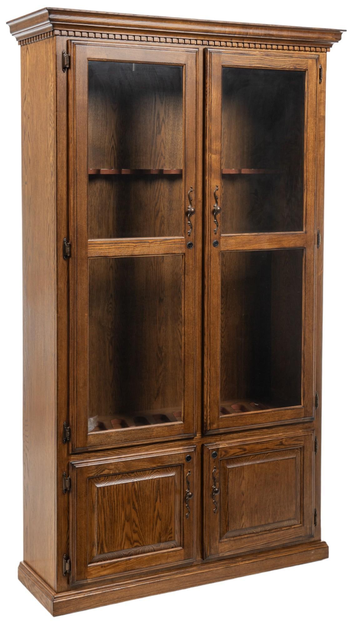 Gun Cabinet: Wooden gun cabinet featuring pair of glass doors that open to interior storage equipped to store and display ten rifles over pair of lower cabinet doors that open to shelved interior storage height 77